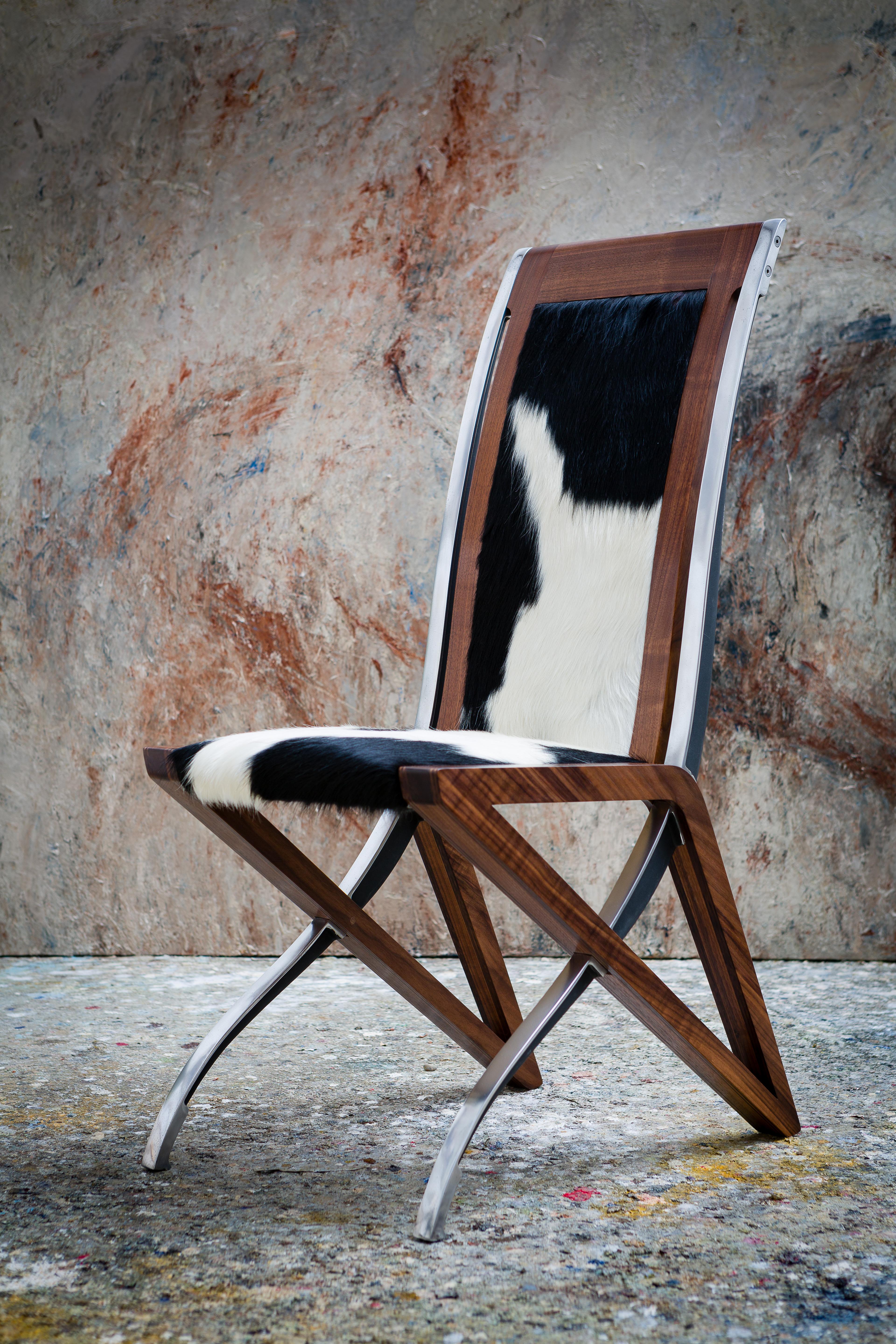 The made to order, unique and powerful design of the Toro dining chair/ conference chair, captures the dynamic strength of a wild bull, bringing a whole new energy into any dining room/ conference room. Strong, elegant and graceful with it's tactile