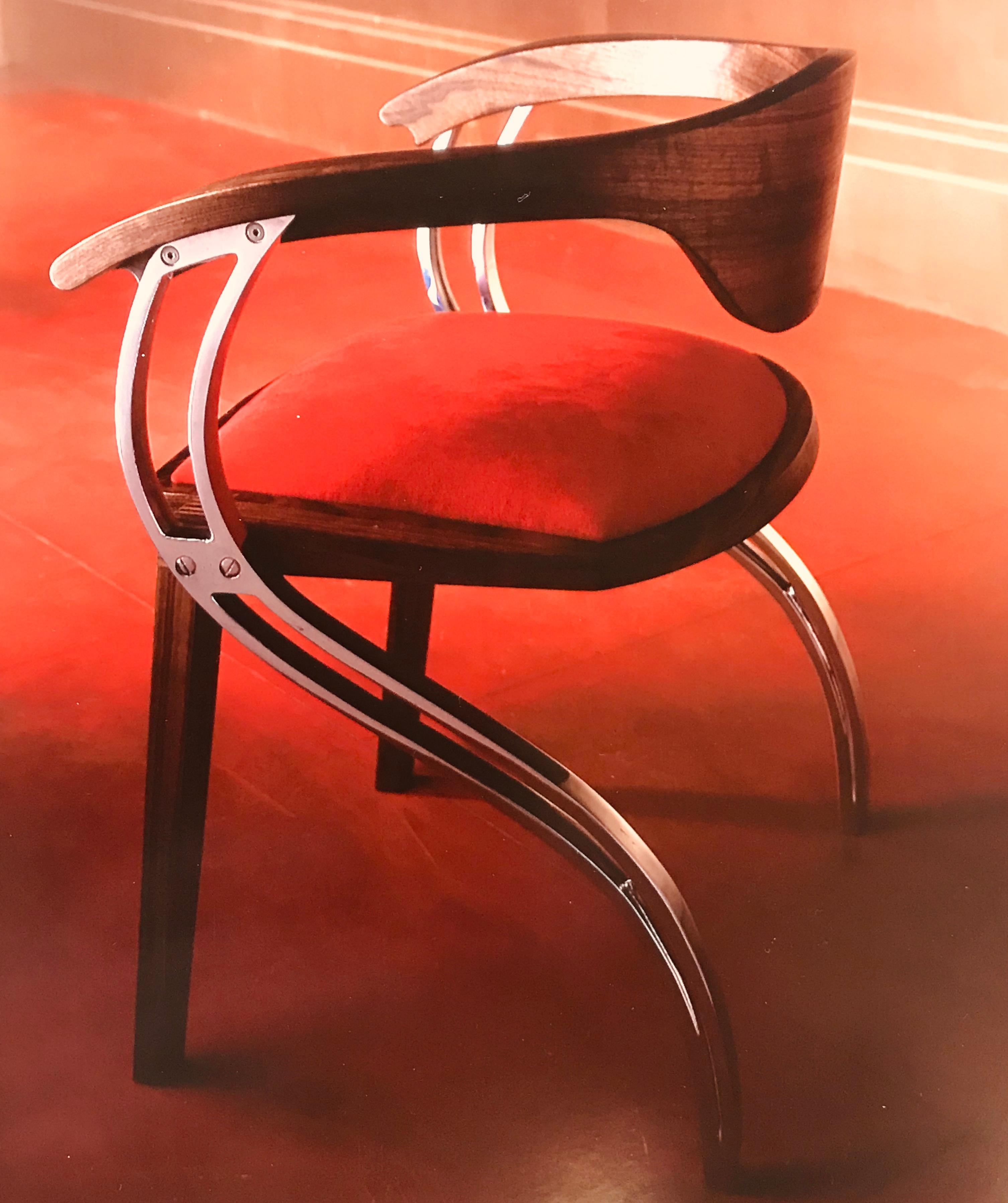 This made to order, elegant and graceful, contemporary chair plays on form and function. The S shaped aluminium legs create lateral supports that catch the seat structure and the 'floating' curved back. This creates a very sculptural, fluid and