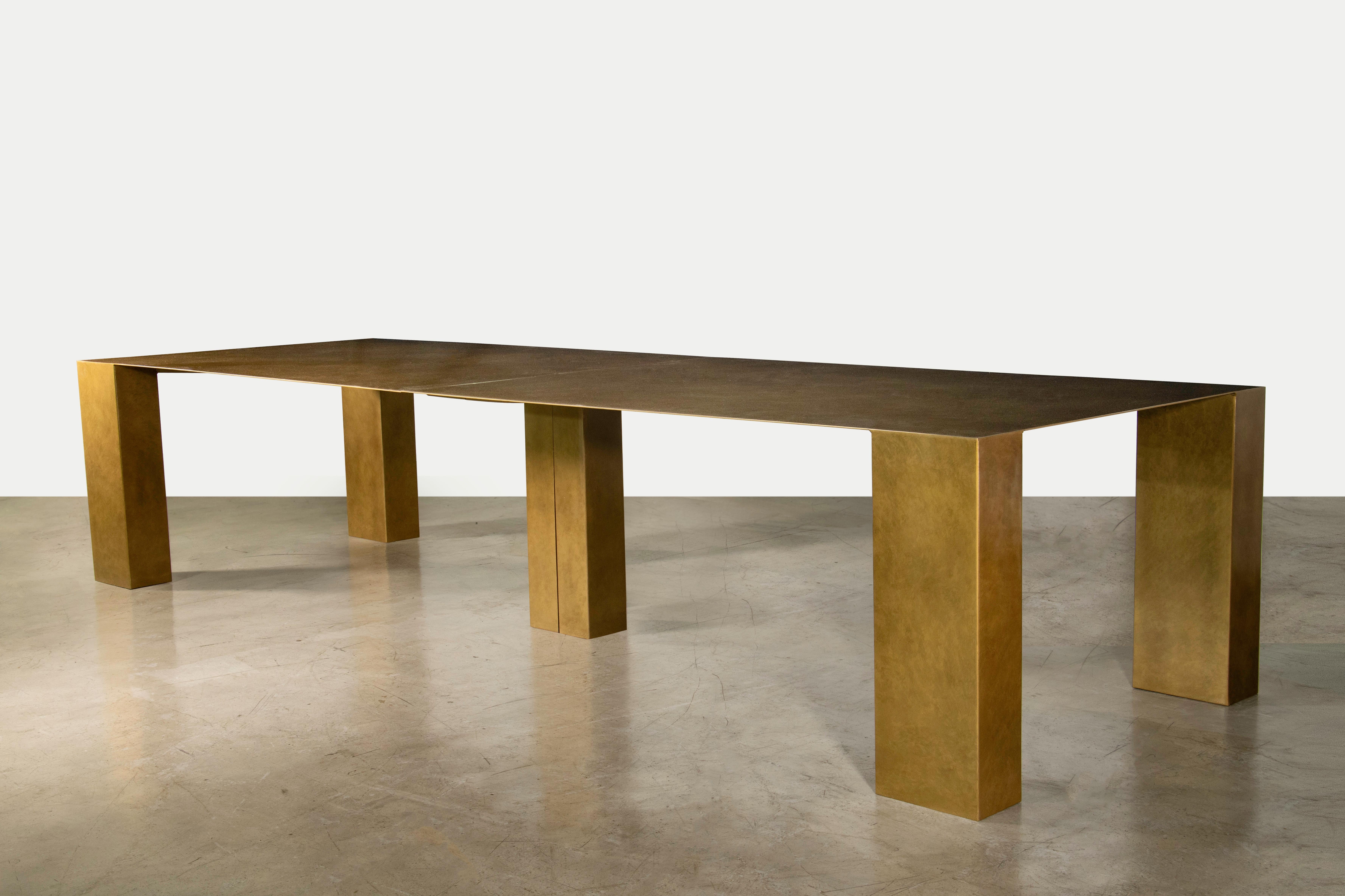 The Alonzo Modern Bronze Customizable Dining Table from Costantini is shown here at 144