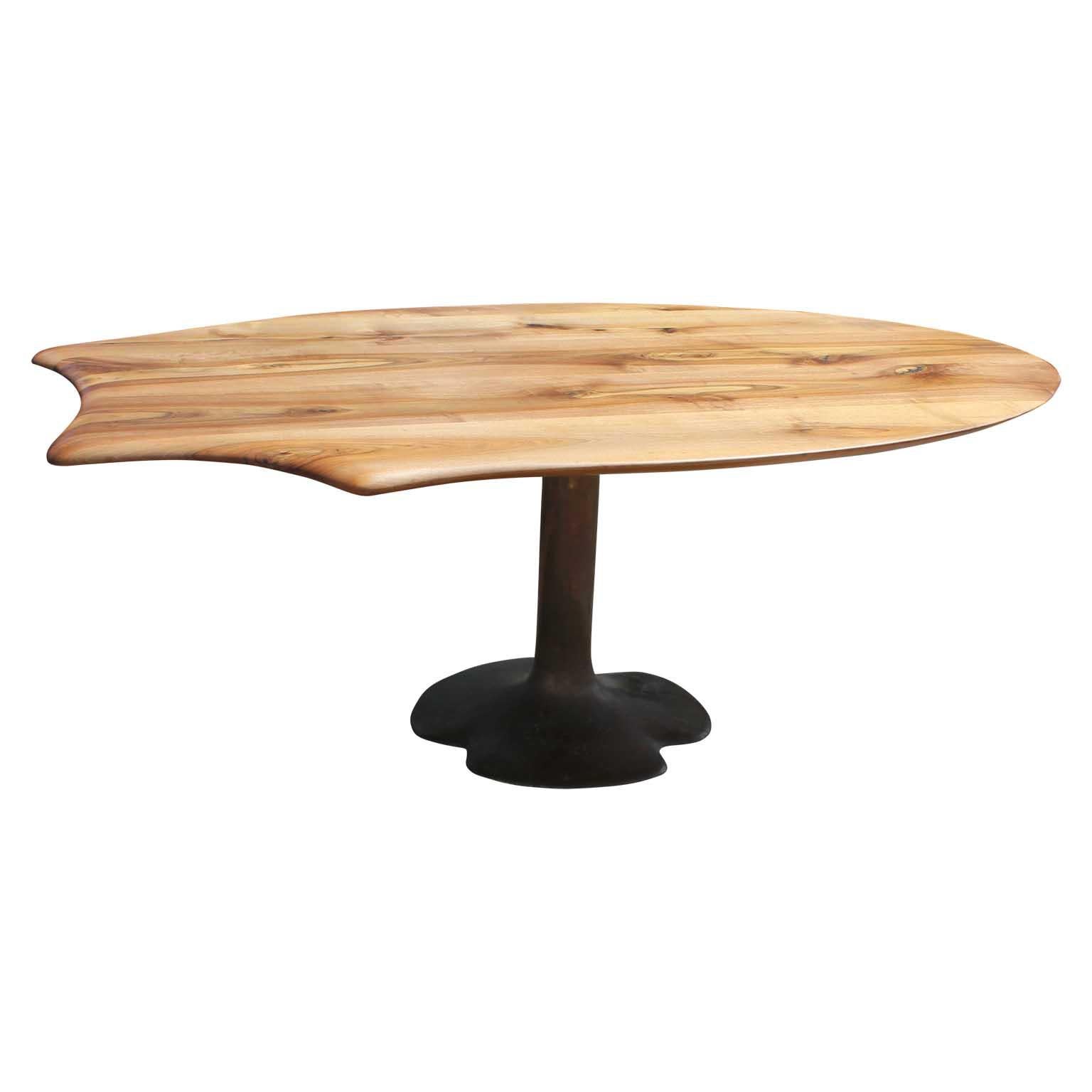 Stunning modern bronze sculptural dining table in walnut. It is made by Oskar Kogoj, and the table has aesthetic sculptural detailing on one end. The table leg is made of bronze and is signed by the designer. His signature also appears on the