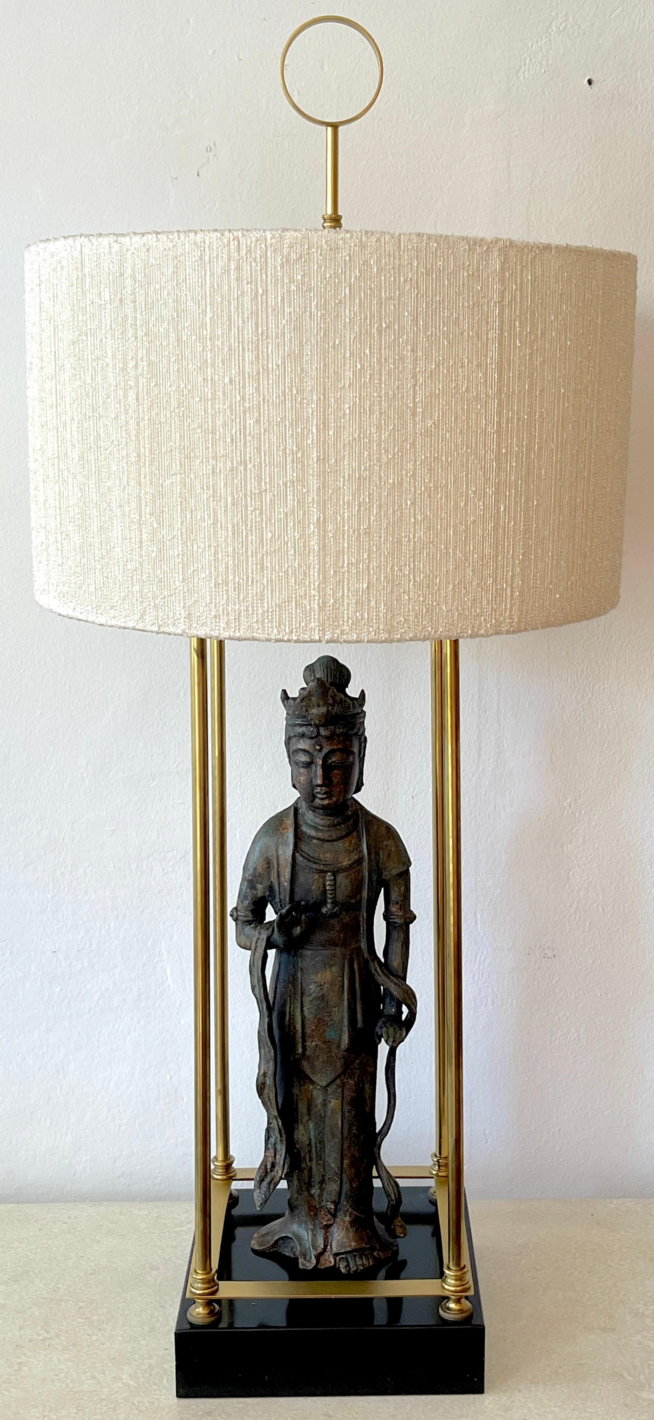 Modern bronze standing figure of guanyn lamp, Attributed to Billy Haines, The patinated bronze figure of Guanyn, within a polished brass trellis, raised on a 9.5