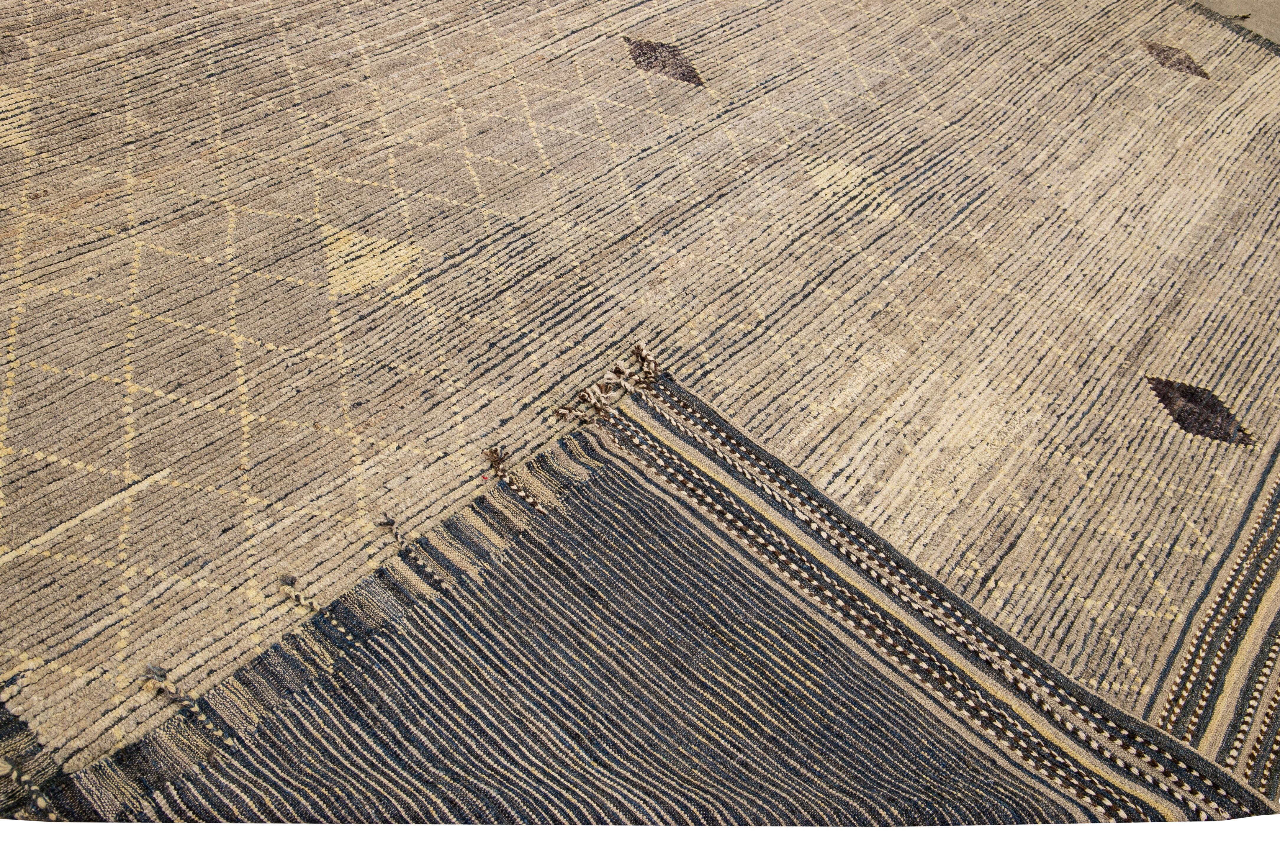 Beautiful Moroccan style handmade wool rug with a brown field. This Modern rug has yellow accents and beige-blue braid fringes featuring a gorgeous all-over geometric boho design.

This rug measures: 13'1