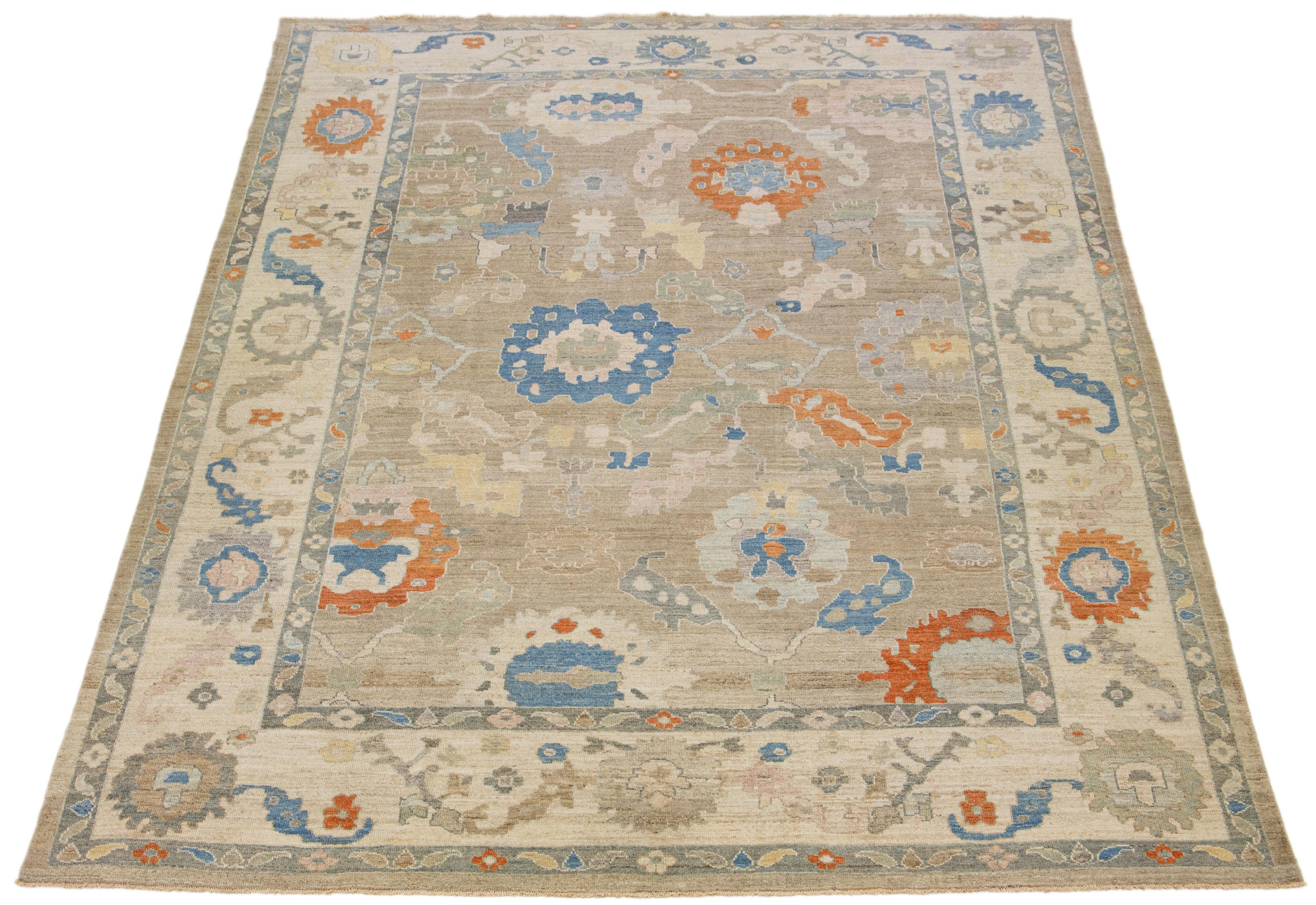 This modern reinterpretation of timeless Sultanabad design is beautifully manifested in an exquisitely hand knotted wool rug, resplendent in its striking light brown shade. An intricate border delineates its all-over floral embroidery, embellished