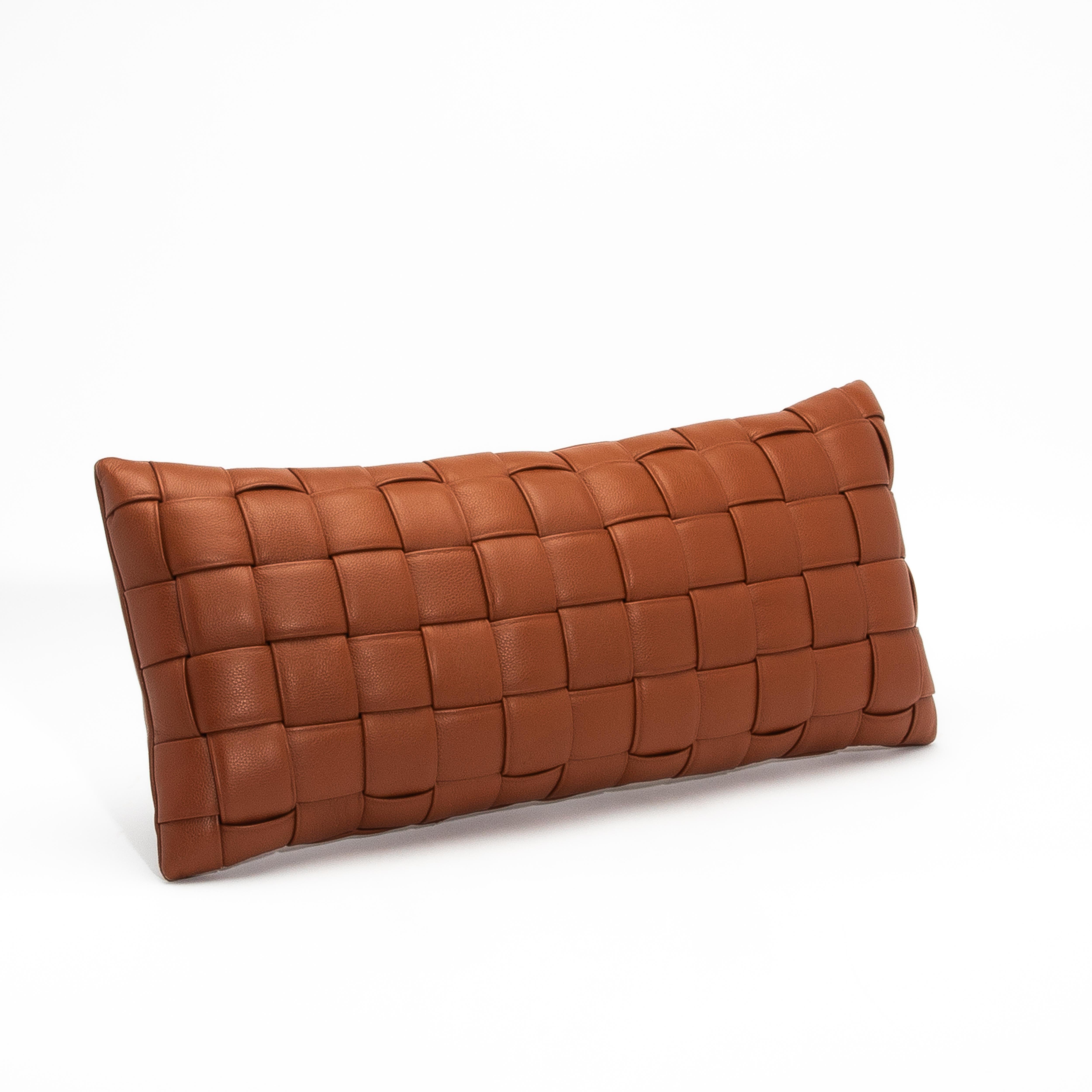 Crafted from premium woven leather, this modern brown decorative lumbar pillow is a masterpiece of artisanal design and impeccable craftsmanship. Each leather panel is meticulously hand-woven, creating a textured grid pattern that exudes