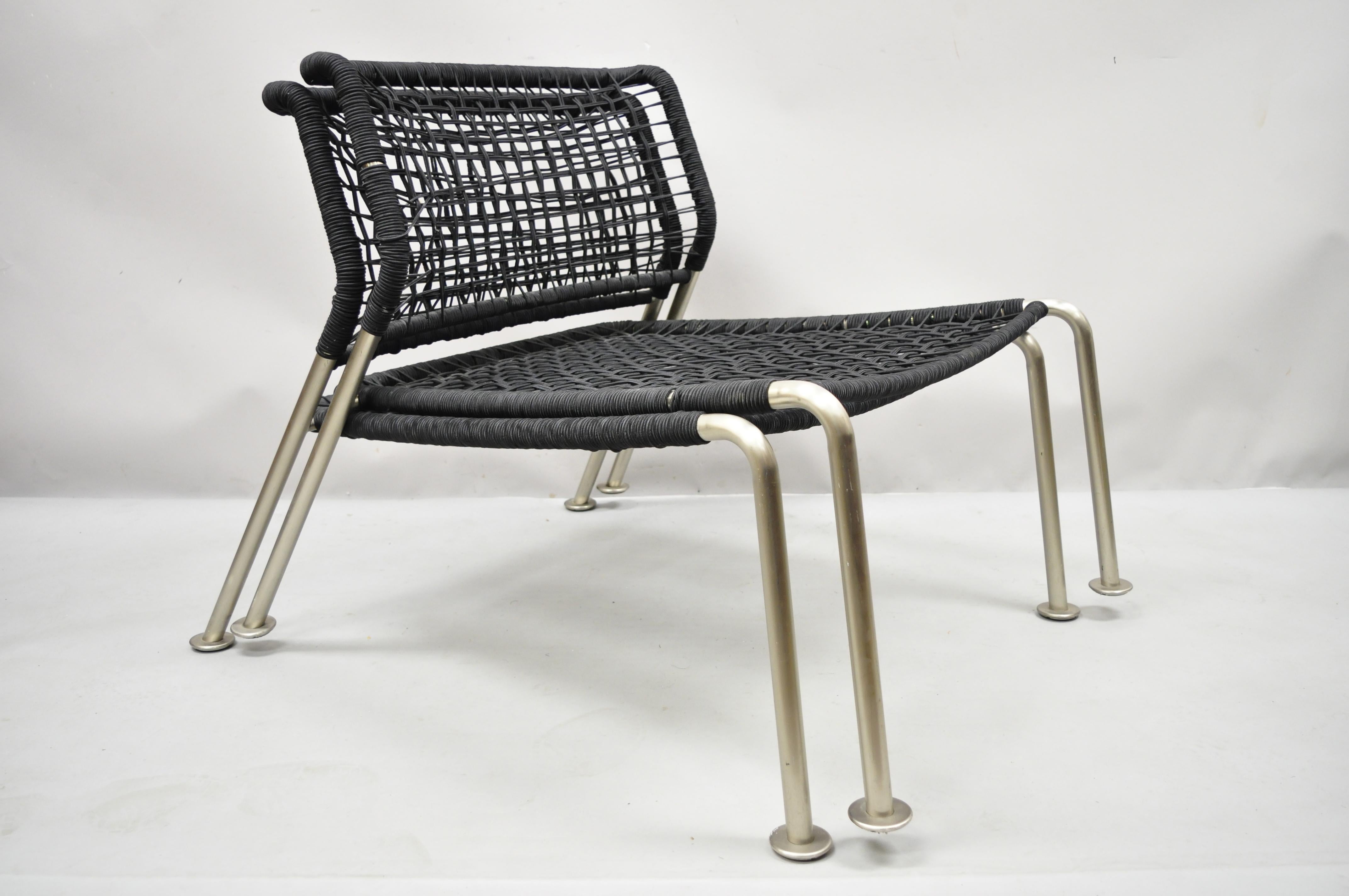 Modern brushed steel low wide frame vinyl rope lounge slipper chairs - a pair. Item features low and wide brushed steel frames, woven vinyl rope seat and back, stackable design, clean modernist lines. Circa Late 20th - Early 21st Century.