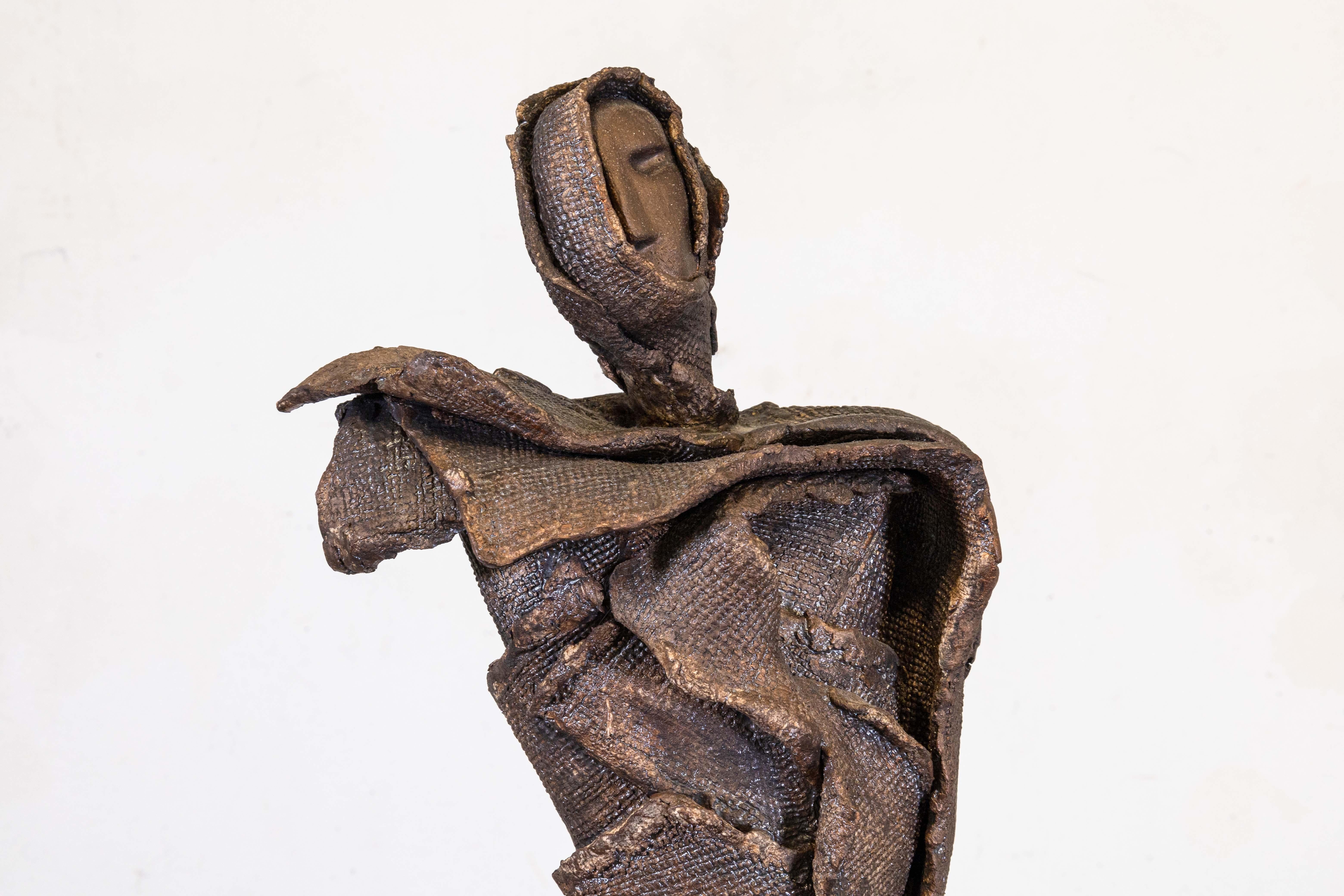 A modern brutalist metal and ceramic sculpture signed Viro. This piece is in very good condition. It measures 38 inches tall, 18 inches long, and 8.5 inches wide. 
