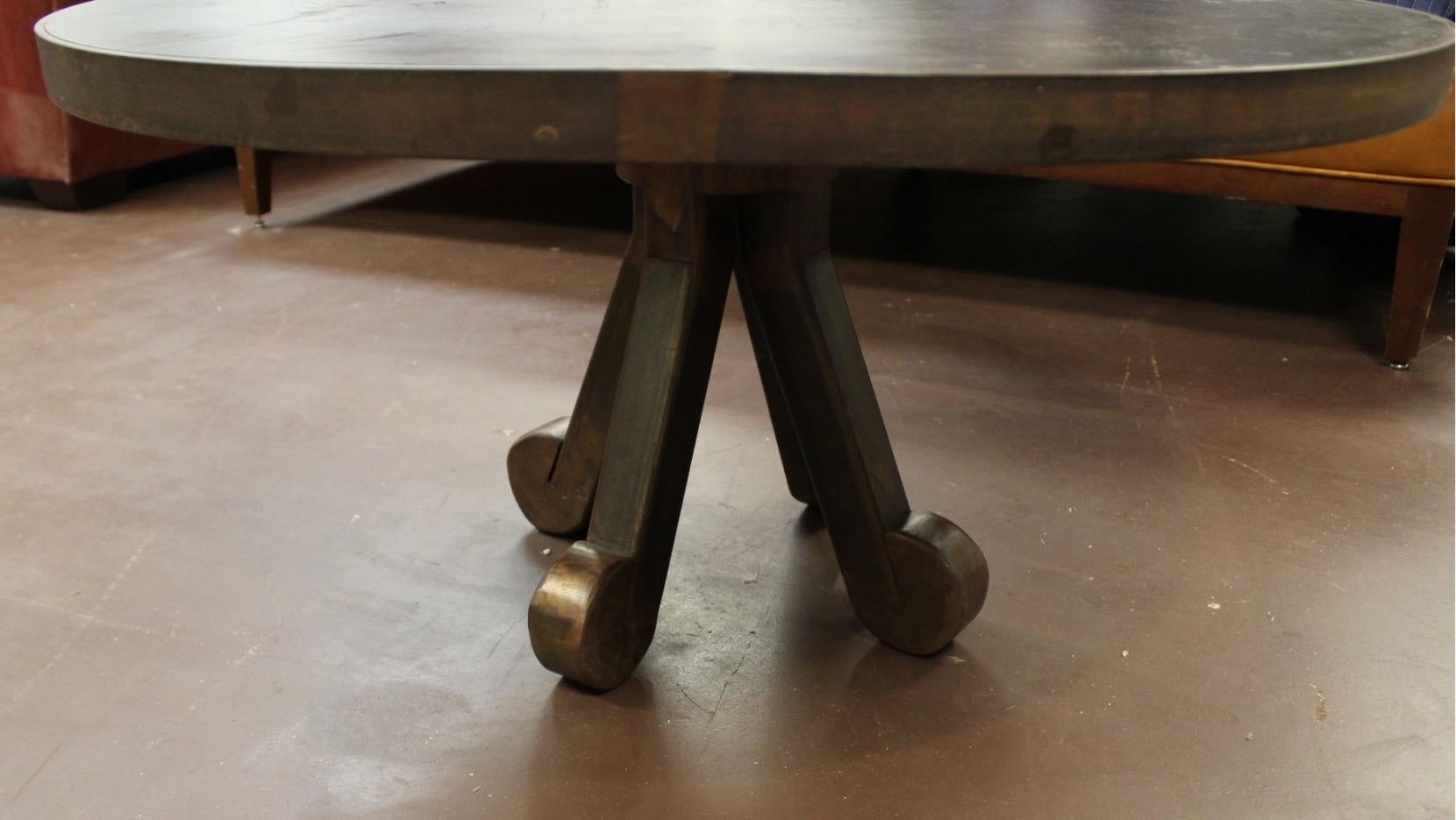 Modern Brutalist round bronzed metal custom coffee cocktail table, curled foot.