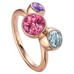 Anello moderno con tormalina rosa a bolla, acquamarina e ametista in oro rosa 18K