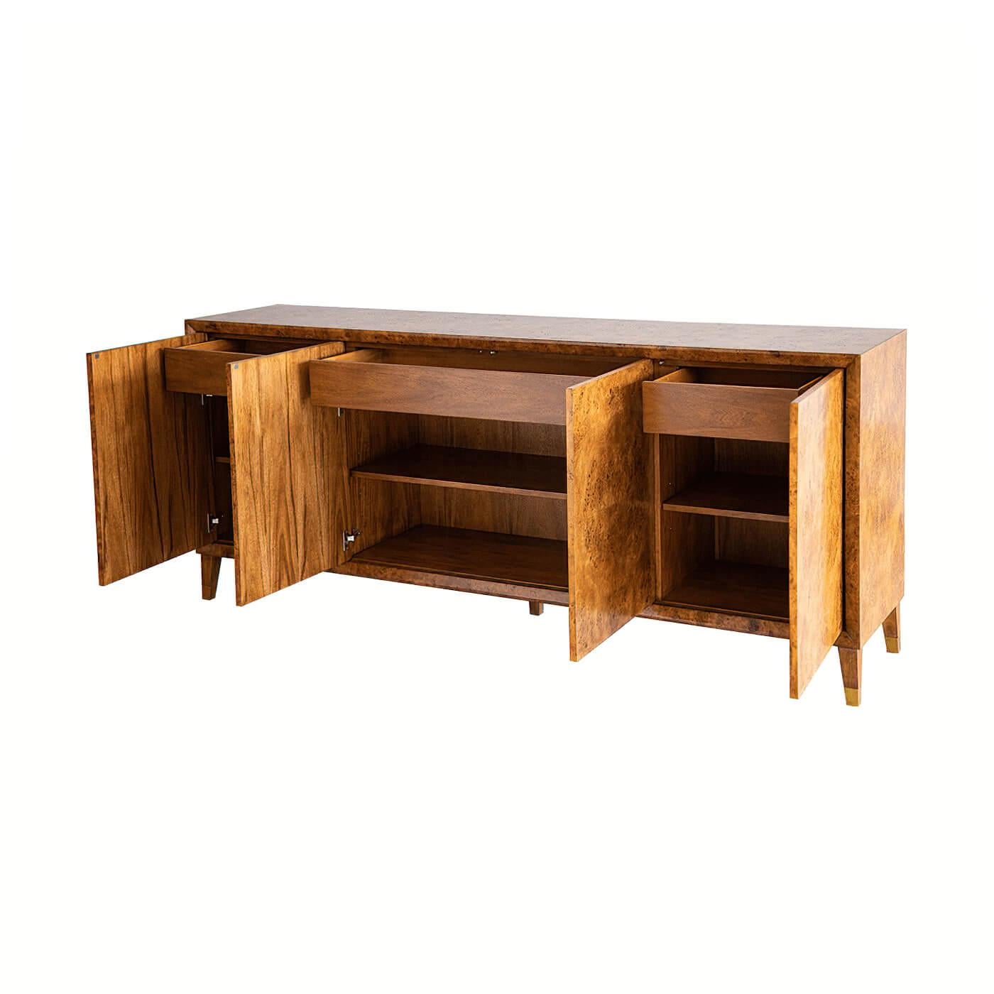 Modern burl buffet sideboard with four doors framed by a beveled edge, with interior drawers and shelves and finished in a lightly distressed rustic warm hand-rubbed finish.
Dimensions: 84