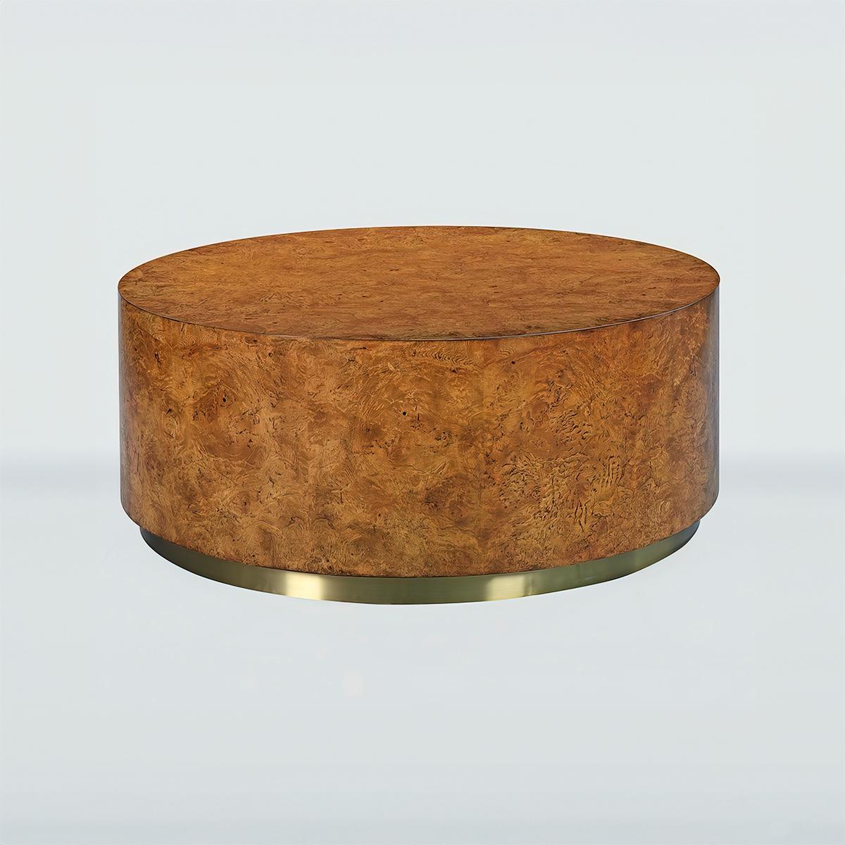 Modern Burl Round Coffee Table, a unique midcentury inspired cylindrical coffee table wrapped in burl wood veneers and raised on a brass metal base.

Dimensions: 38