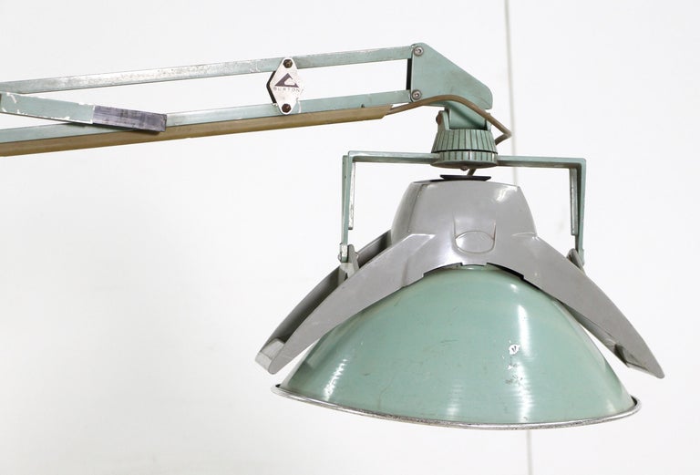 Mid-Century Modern surgical operating room ceiling mounted light green light. Comes with separate adjustable arms which can be aimed as desired. Cleaned and restored. Made by Burton Medical. Model 315.