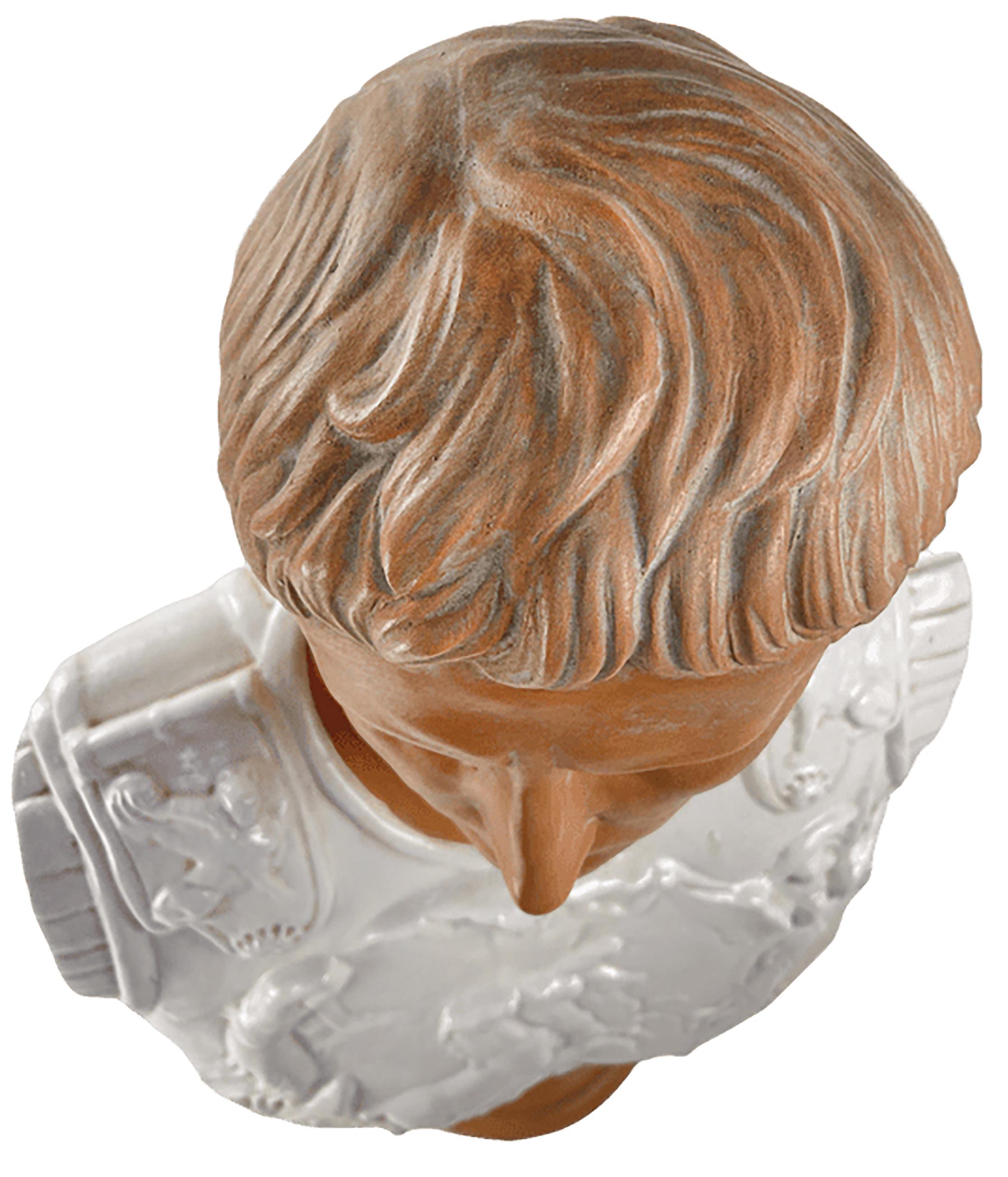 A masterfully hand carved sculptural bust of a Roman soldier. This is a modern reproduction of a roman era bust with a glazed finish.

The figure holds a slight contrapposto between the head and the chest plate area. The chest is colored white