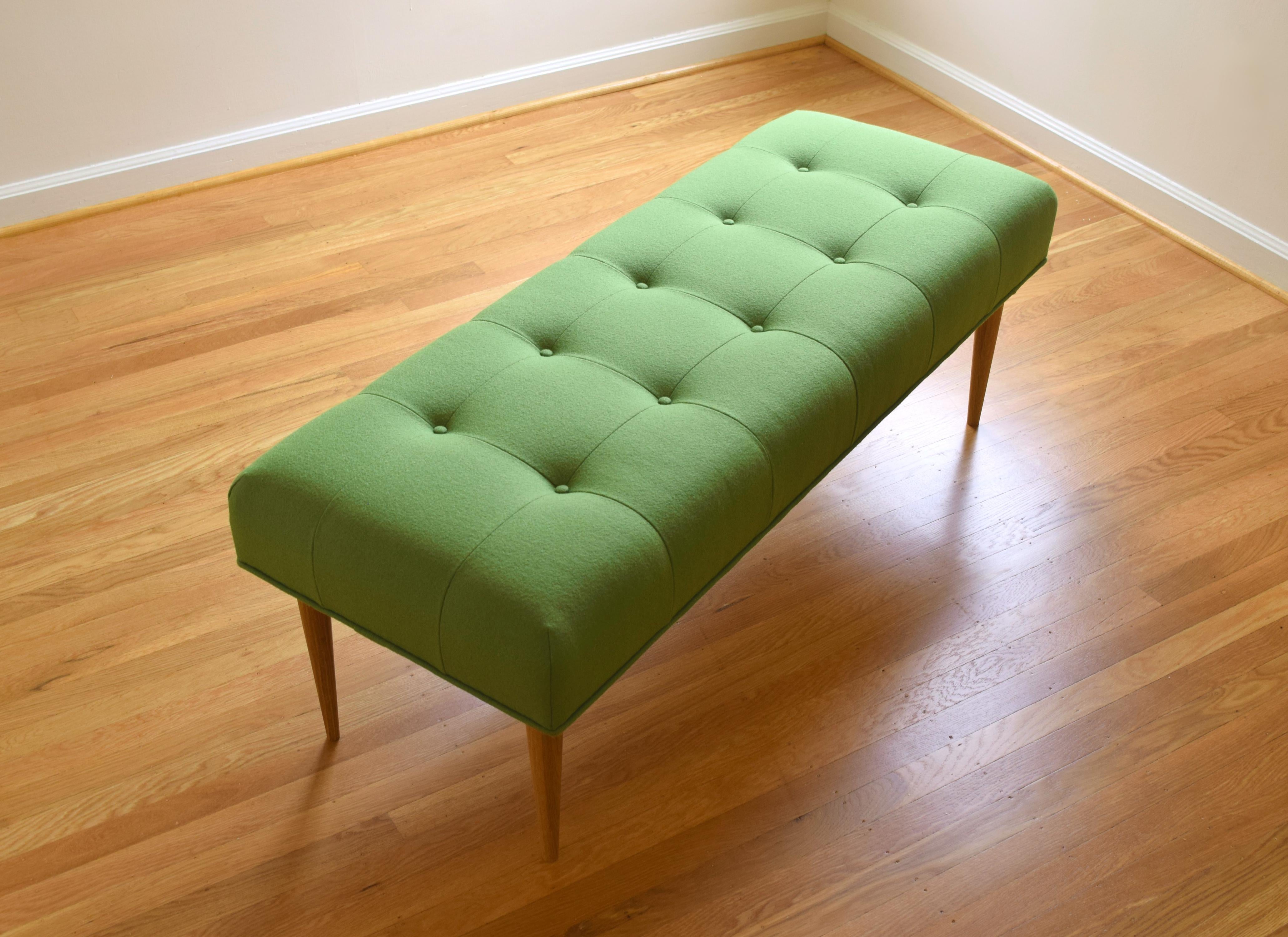 green upholstered bench