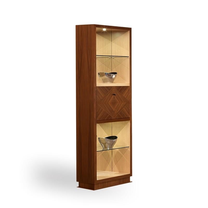 Bar cabinet in wood realised in Canaletta walnut and natural maple. Shelves in transparent glass. Handles in steel. Doors are enriched with elegant rhombus inalys. With lighting.