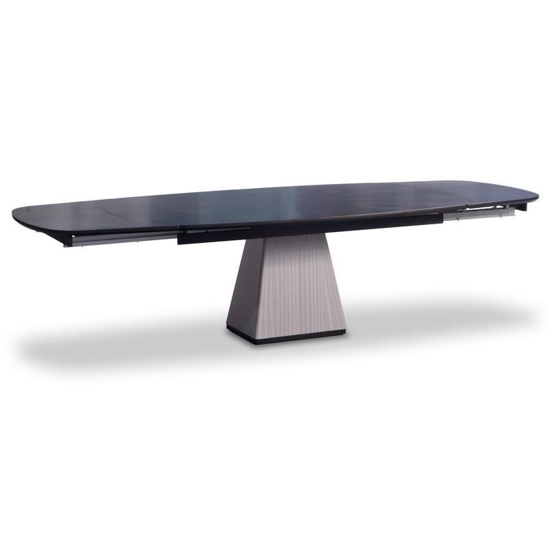 Table with top in Sycomoro dark frisè wood, enriched by an elegant geometrical inlay. The base has a trapezoidal shape and it is in Pama wood. The table is extendible. Closed is cm 210, open is cm 310.