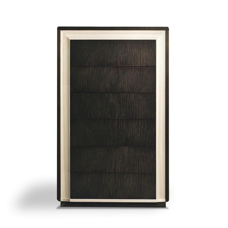 Cabinet characterized by the elegant line. The structure is realized in Sycomoro dark frisè wood and it is embellished with a frame in Pama wood. The six drawers have push and pull mechanism and slow closing system. It is suitable both for day and