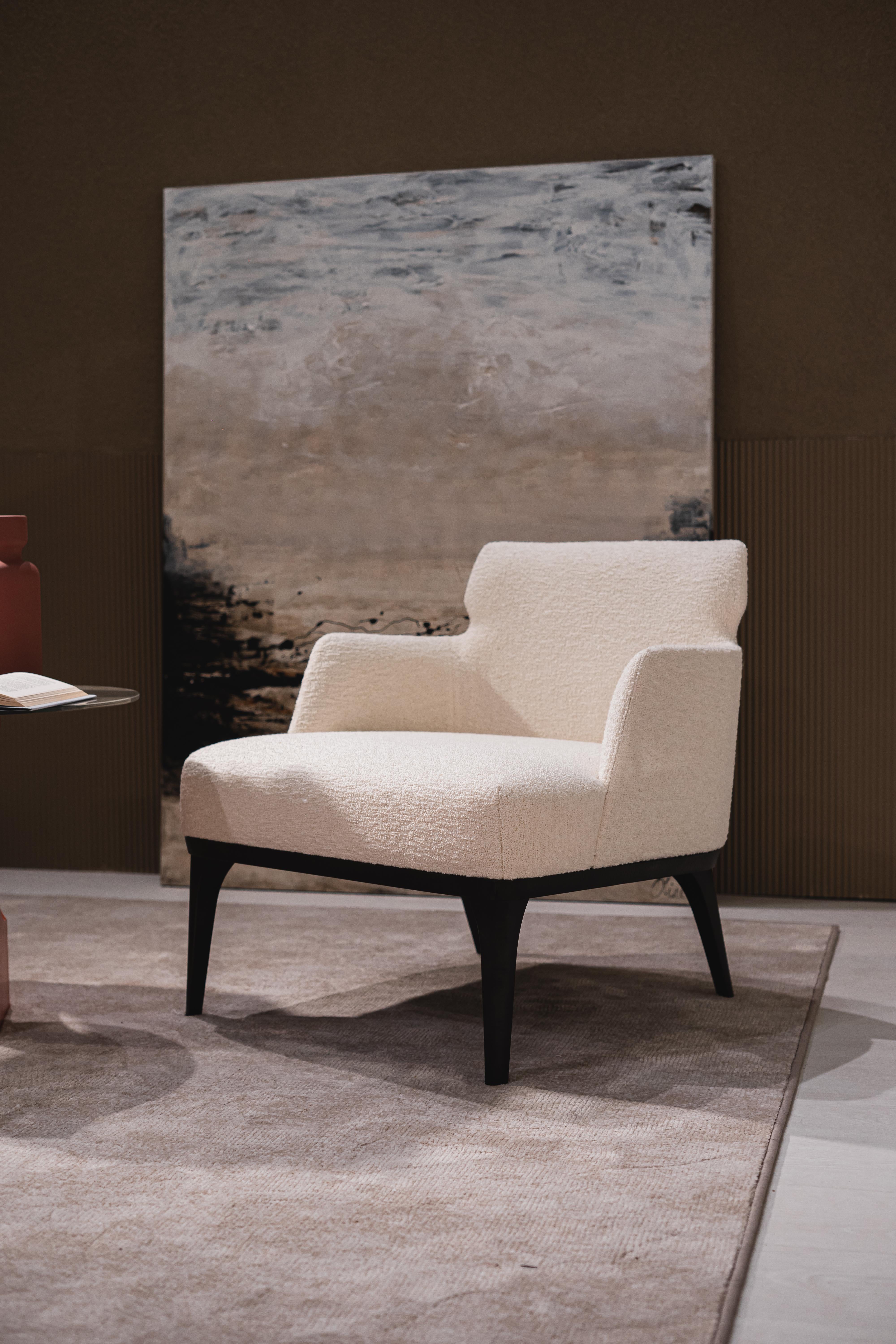 Armchair from the Shape line, internal wooden structure, polyurethane padding in different densities, solid wood feet in dark Tay shade. Also available in Canaletta walnut tone.
Upholstery available in various fabrics, leather and Nabuk.