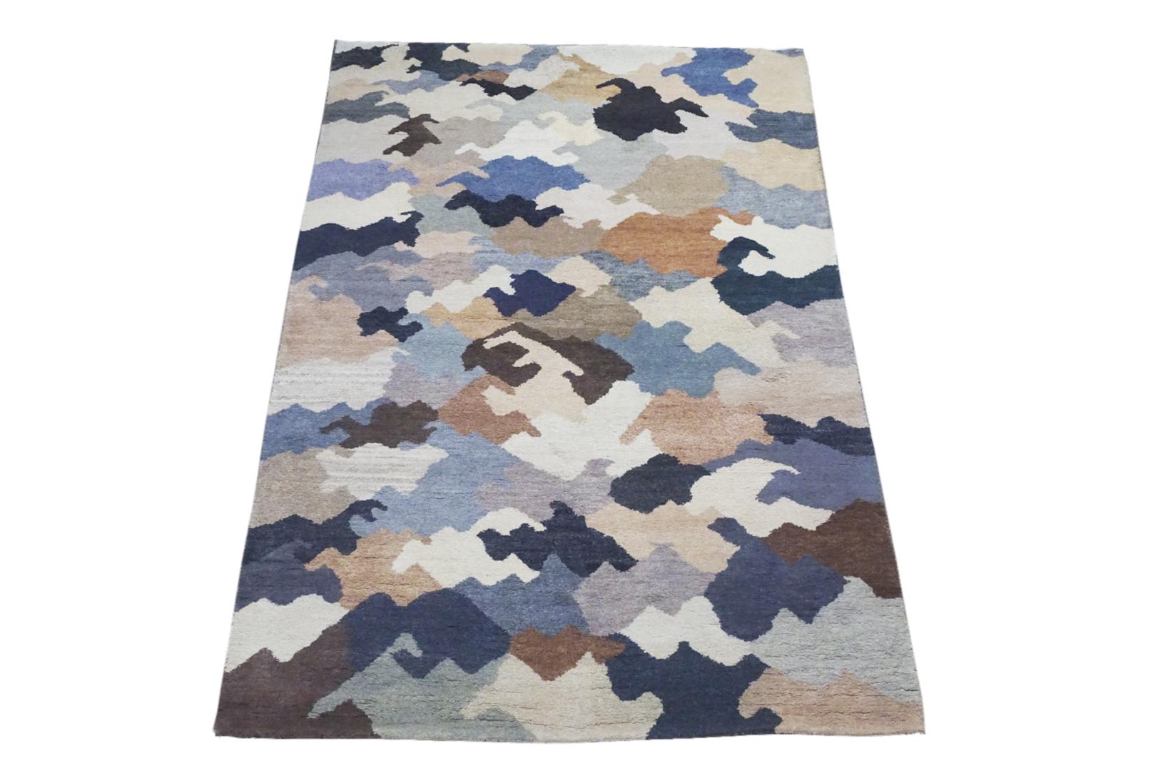 Hand knotted wool pile on a cotton foundation.

Modern multicolored camouflage design.

Dimensions: 6'4