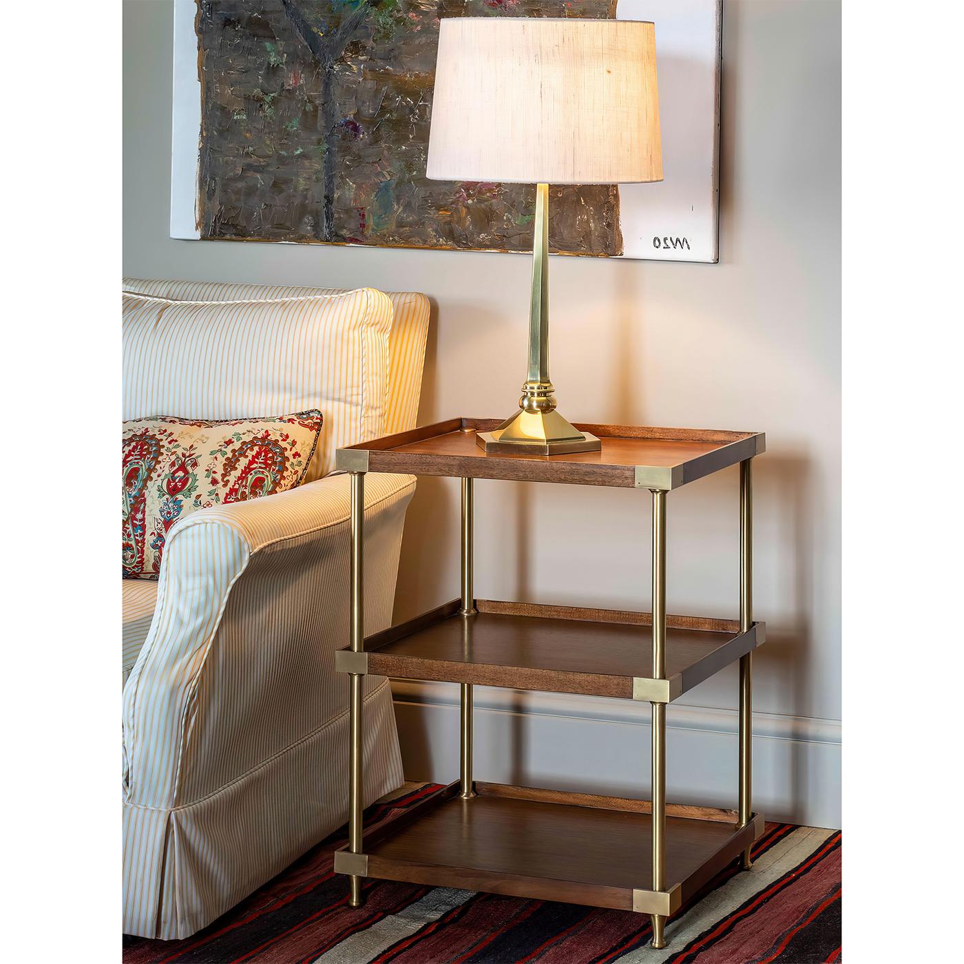 Modern Campaign Style Etagere. A combination of a traditional English campaign style with an updated modern design.

This three-tier etagere is a satisfying combination of wood and brass, it has a sophisticated, modern feel to it.

Dimensions: