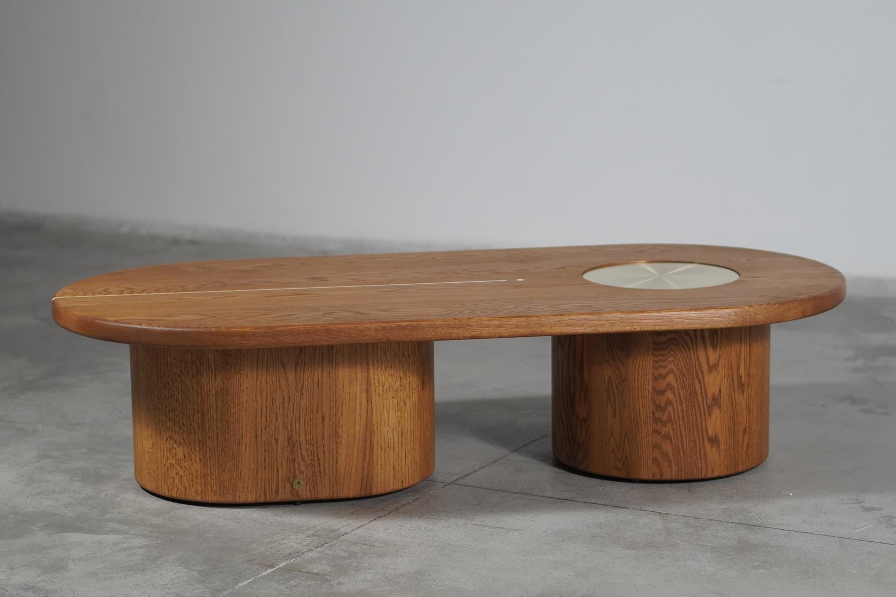 Celeste coffee table in solid Oak blends well and brings character to modern and contemporary spaces. This low coffee table design draws inspiration from the volumes and textures of celestial bodies. Strong bold and robust, the monolithic forms in