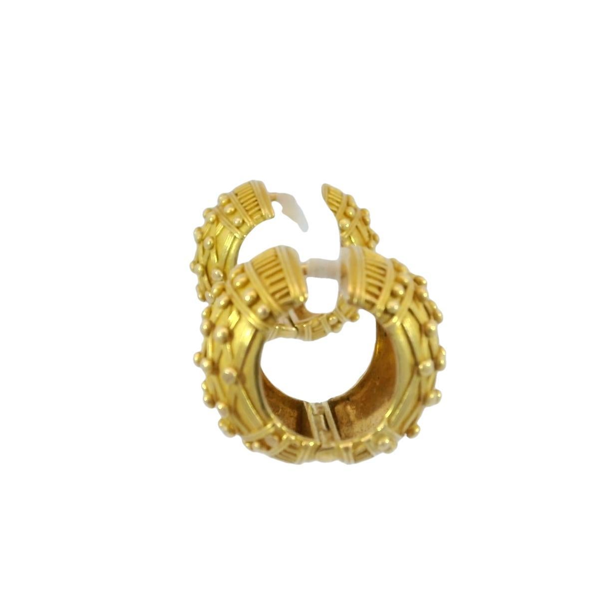 22k Designer Hoop Huggie Earrings 18.4 Grams Modern by Carolyn Tyler

These Carolyn Tyler earrings are a perfect fusion of timeless craftsmanship and contemporary elegance. Designed in 22K yellow gold, they feature a beautifully textured surface