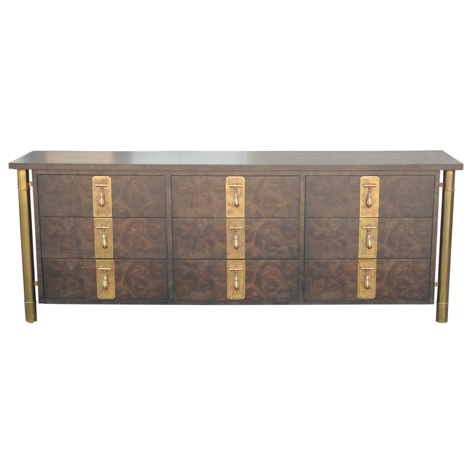 Gorgeous Mastercraft dresser featuring nine drawers made from a lovely Carpathian Elm Burl with brass pulls and accents.