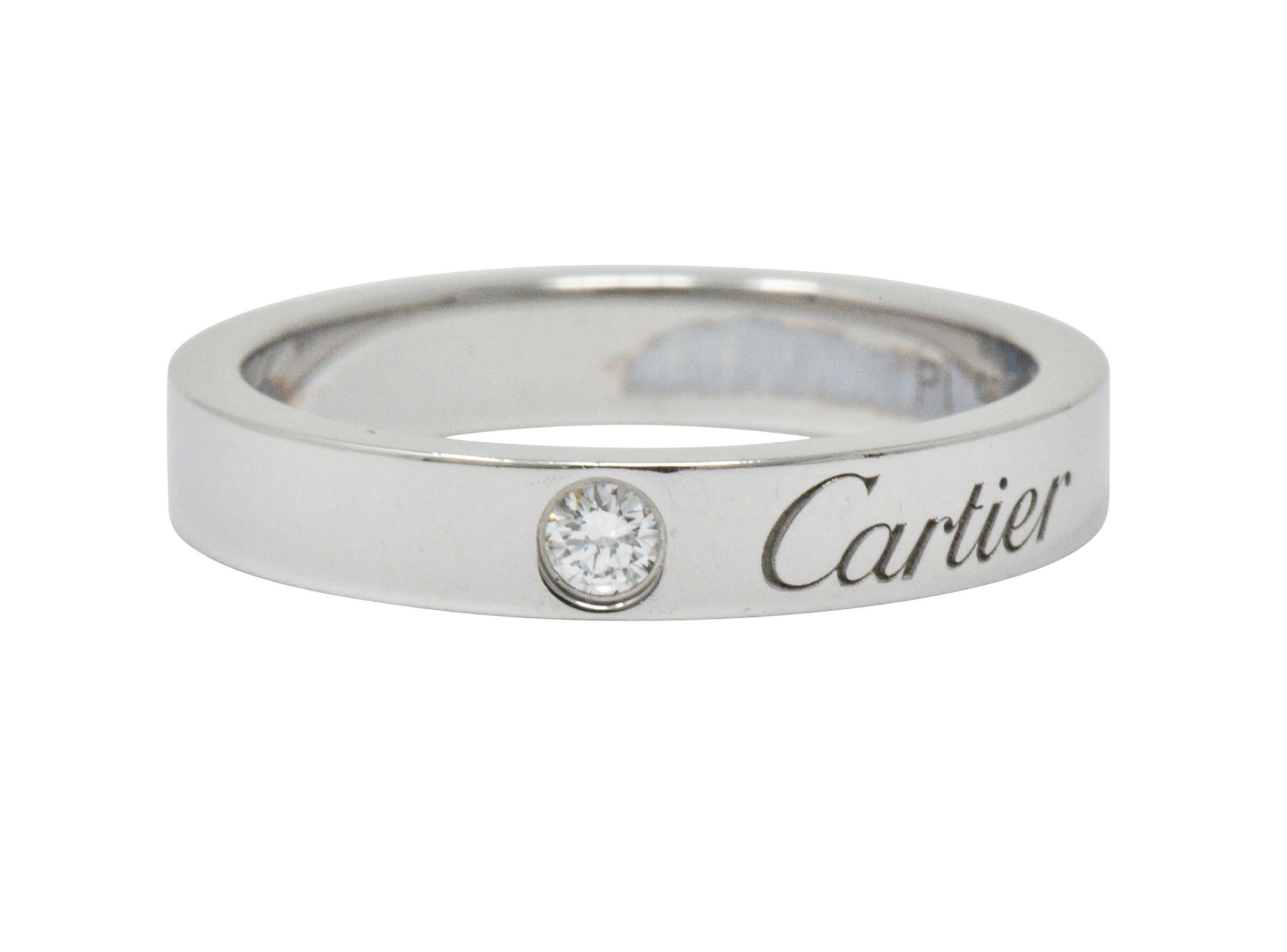 Featuring 1 flush set round brilliant cut diamond weighing 0.03 carats total, G color and VS clarity

Straight flat band

Fully signed Cartier on front

Stamped with maker's mark and numbered

Ring Size: 4 & Sizable

Top measures 3.0 mm and sits 1.5