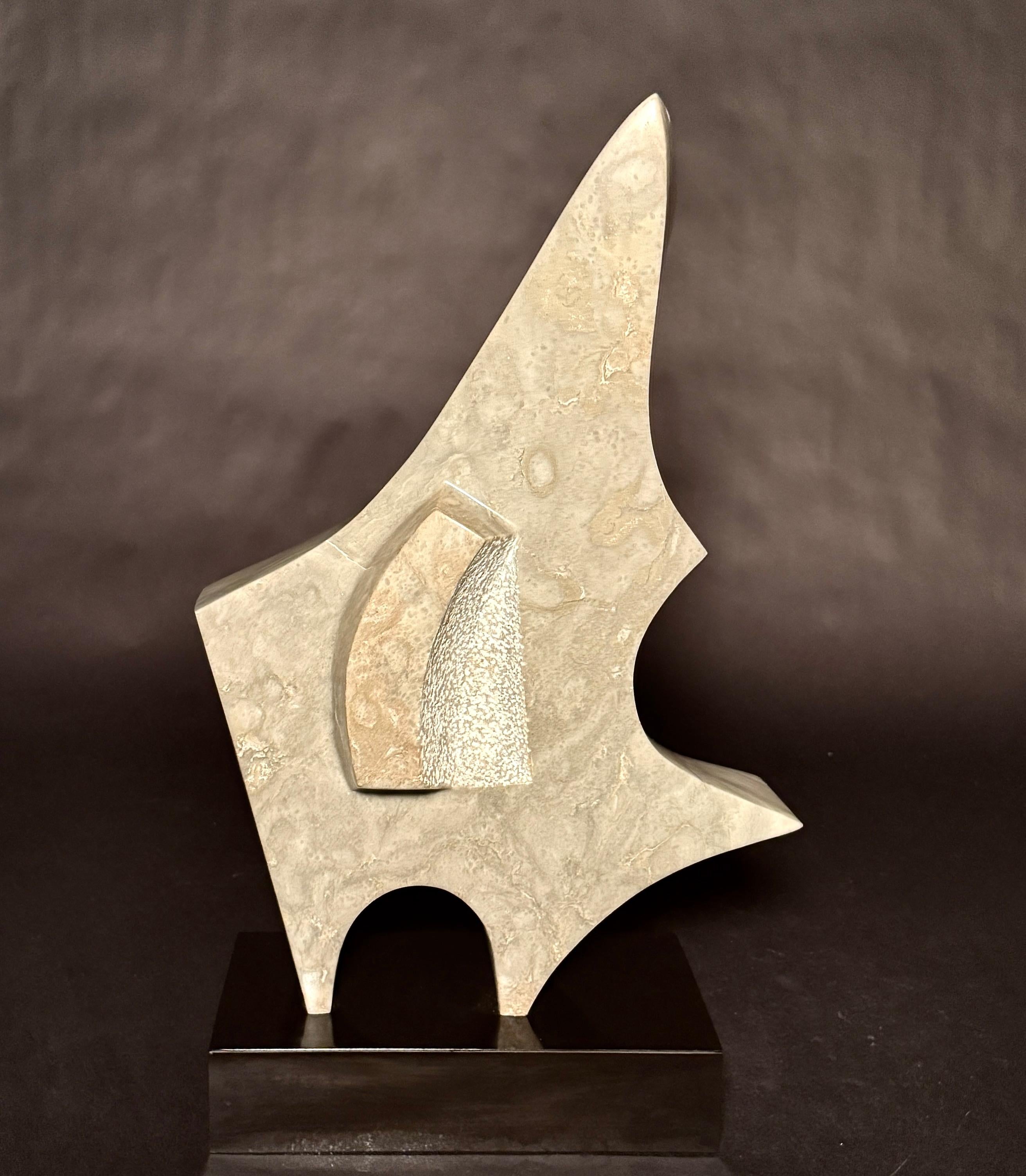 Beautiful geometric form carved marble abstract form sculpture. A gray and white marble, with a faint green hue is beautifully sculpted with a feel of movement in its geometric abstract form. Signed and dated LP, '85.
