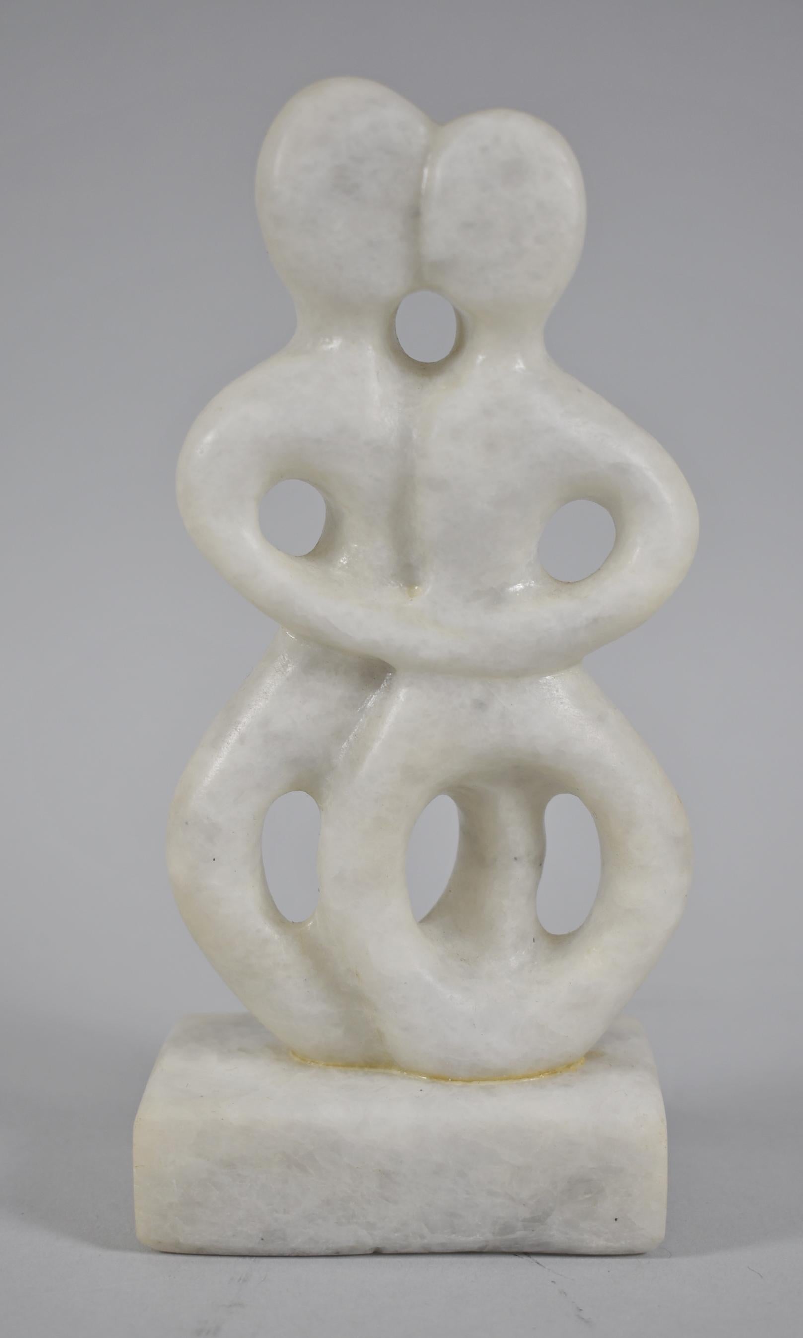 Modern carved marble male & female entwined figural sculpture.