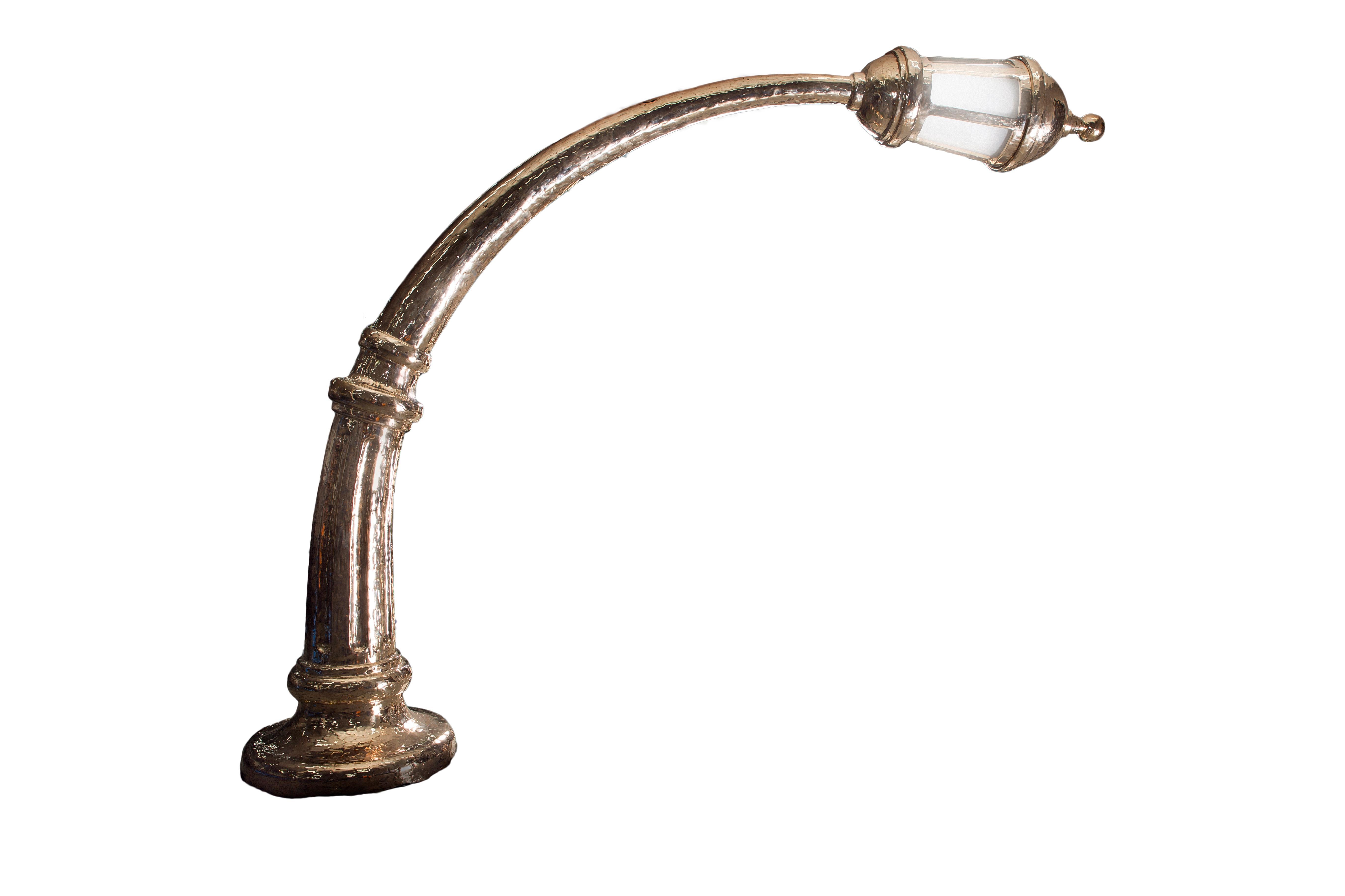 This gravity-defying bronze lamp is not only a stunning sculpture but also holds a practical connection to design history, drawing inspiration in its measurements from the iconic 'Arco Lamp', renowned for its status as the perfect scale. This golden