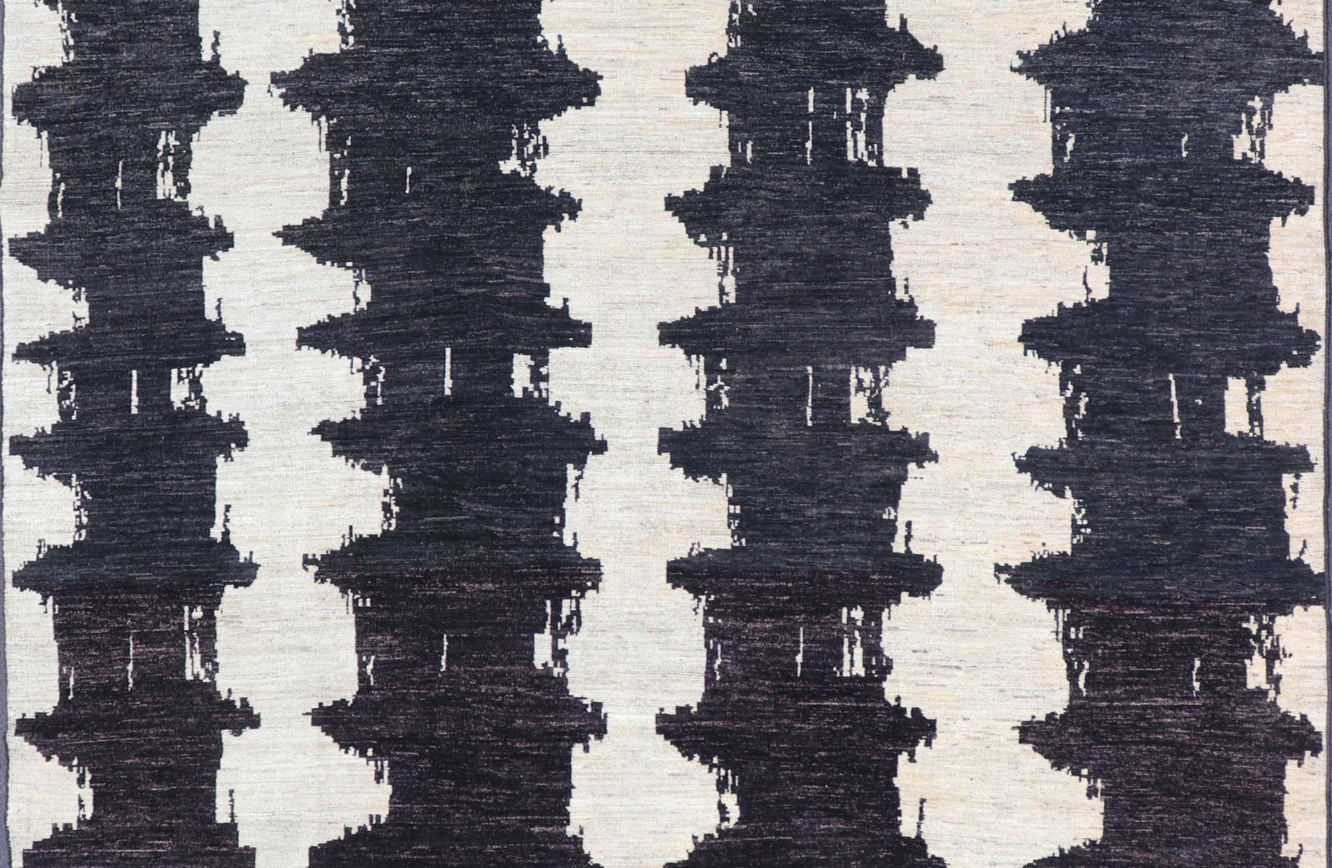 Measures 9'6 x 12'1 

This modern casual Afghan rug has a minimalistic design of vertical motifs paneled asymmetrically in black and white. This piece has been hand-knotted with a piled texture, giving the foundation durability.

Modern Afghan