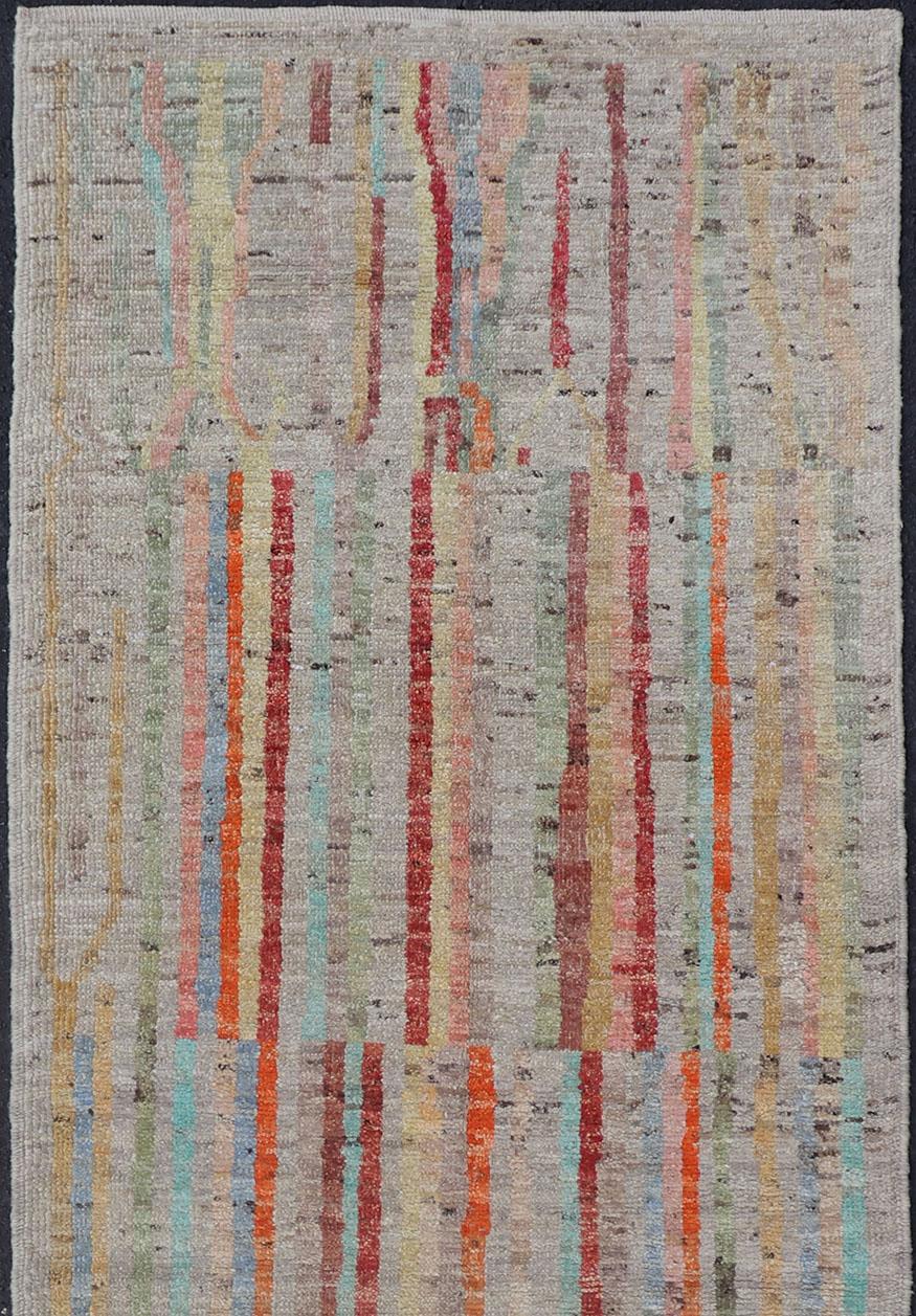 Modern piled runner with ivory/creamy background color and variation of vivid accent colors, rug AFG-36090, Keivan Woven Arts country of origin / type: Afghanistan / Piled, condition: new

This Minimalist design runner features a modern causal