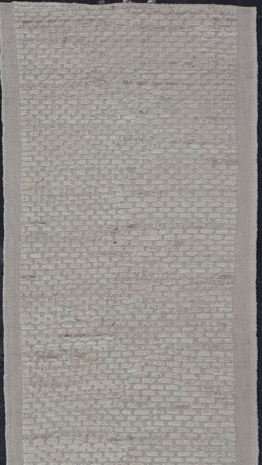 Modern piled and kilim runner with creamy color and variation of random light taupe accents, Keivan Woven Arts / rug AFG-36104, country of origin / type: Afghanistan / Piled, condition: new

This Minimalist design runner features a modern solid