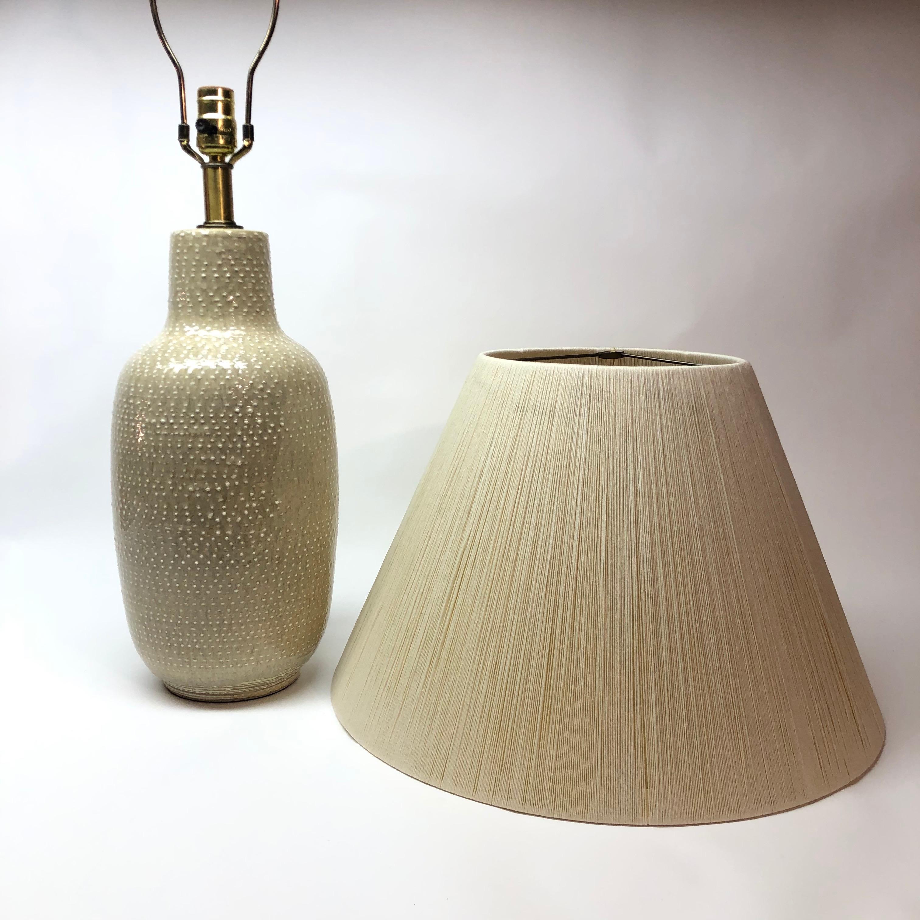 Art pottery ceramic table lamp... shade not included.

Measures: Lamp base 29.75