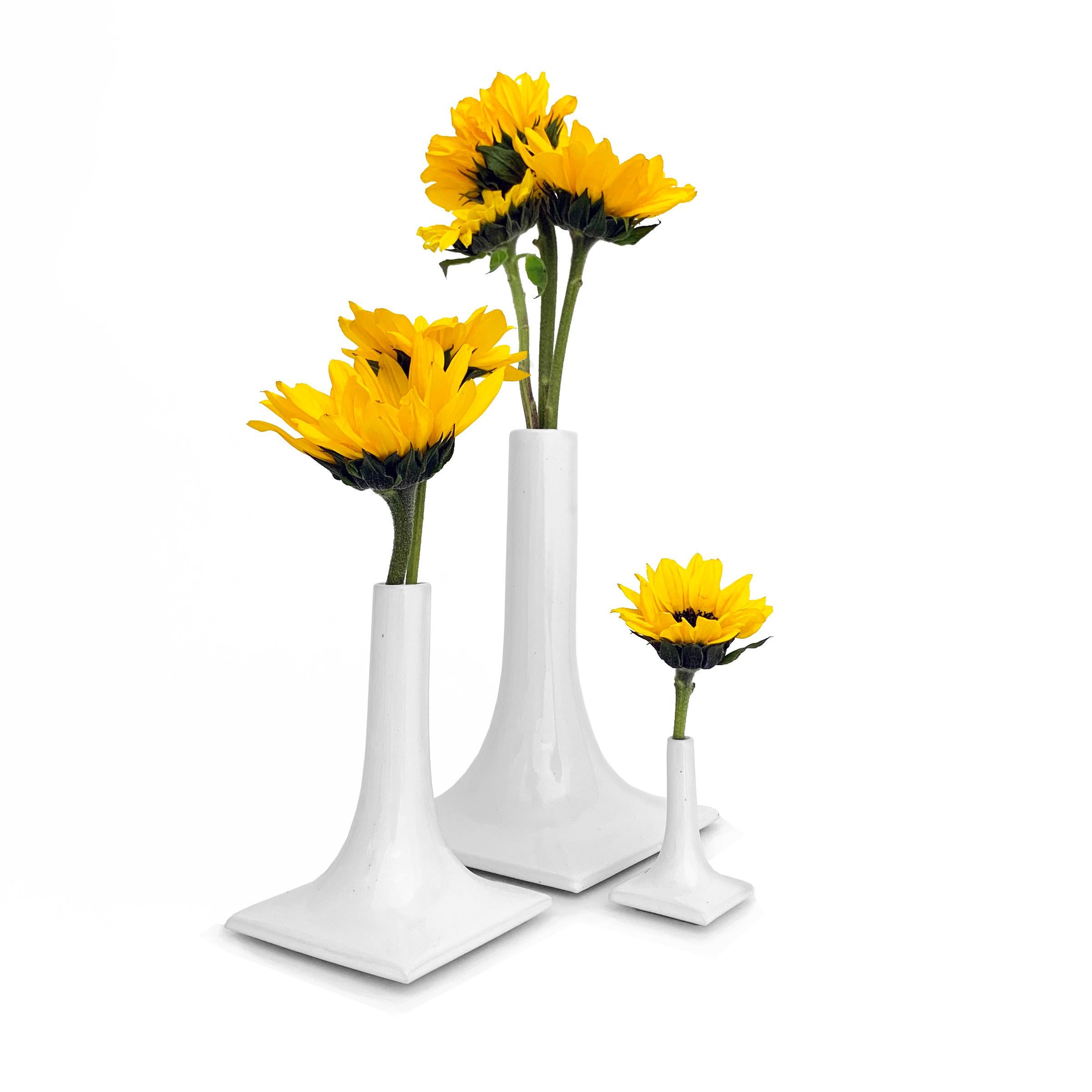Treat yourself and your table with an iconic modern mini table scape of ceramic stacks vases. Proportional in size with a 3