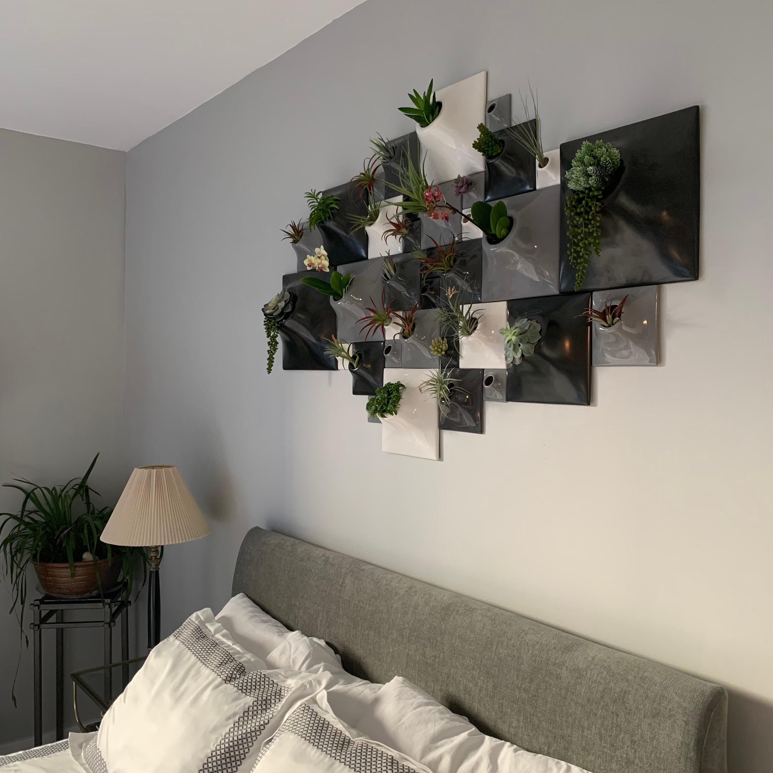 Node Wall Planter - Greenwall Set

Transform your modern home into an epicenter for living wall art with this configuration of Node wall planters available in five neutral glaze colors.  Let your eyes wander over this vertical sculpture garden above