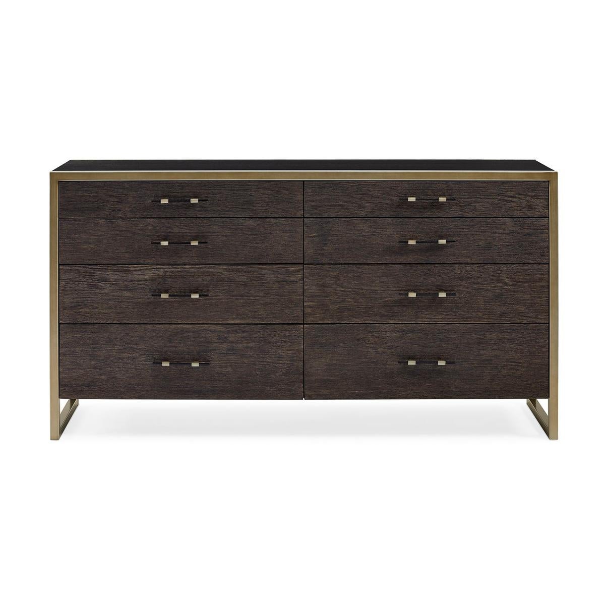  a restrained silhouette is brought to life with a modern layering of bold finishes and warm metallics. While this dresser offers several spacious drawers beautifully finished in Cerused Oak, the beauty of the piece is found in its geometric