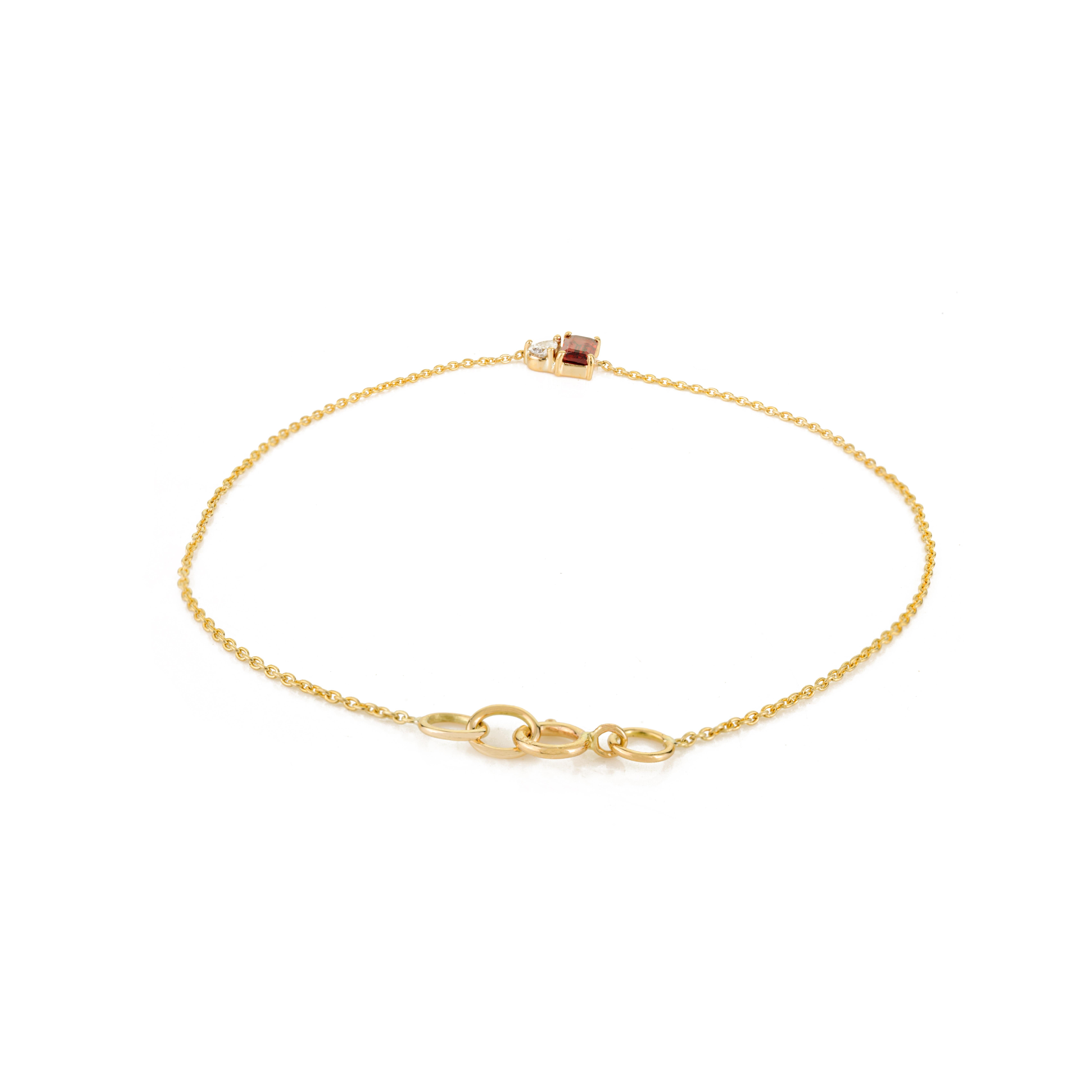 Gracefully minimalist with a touch of bold charm, this Toi et Moi bracelet is crafted in luminous 14K yellow gold. At its center, a richly hued 0.37-carat baguette-cut garnet pairs beautifully with a sparkling 0.08-carat pear-cut diamond, creating a
