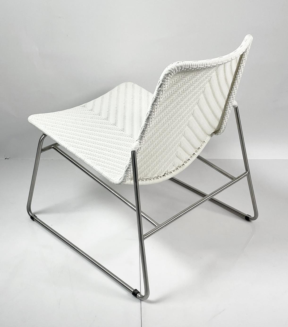 Beautiful chair with clean lines, chromed frame a faux wicker seat.
The chair is very comfortable and it can be used indoors or outdoors.

Measurements:
31 inches high x 22 inches wide x 29 inches deep x 17 inches seat height.