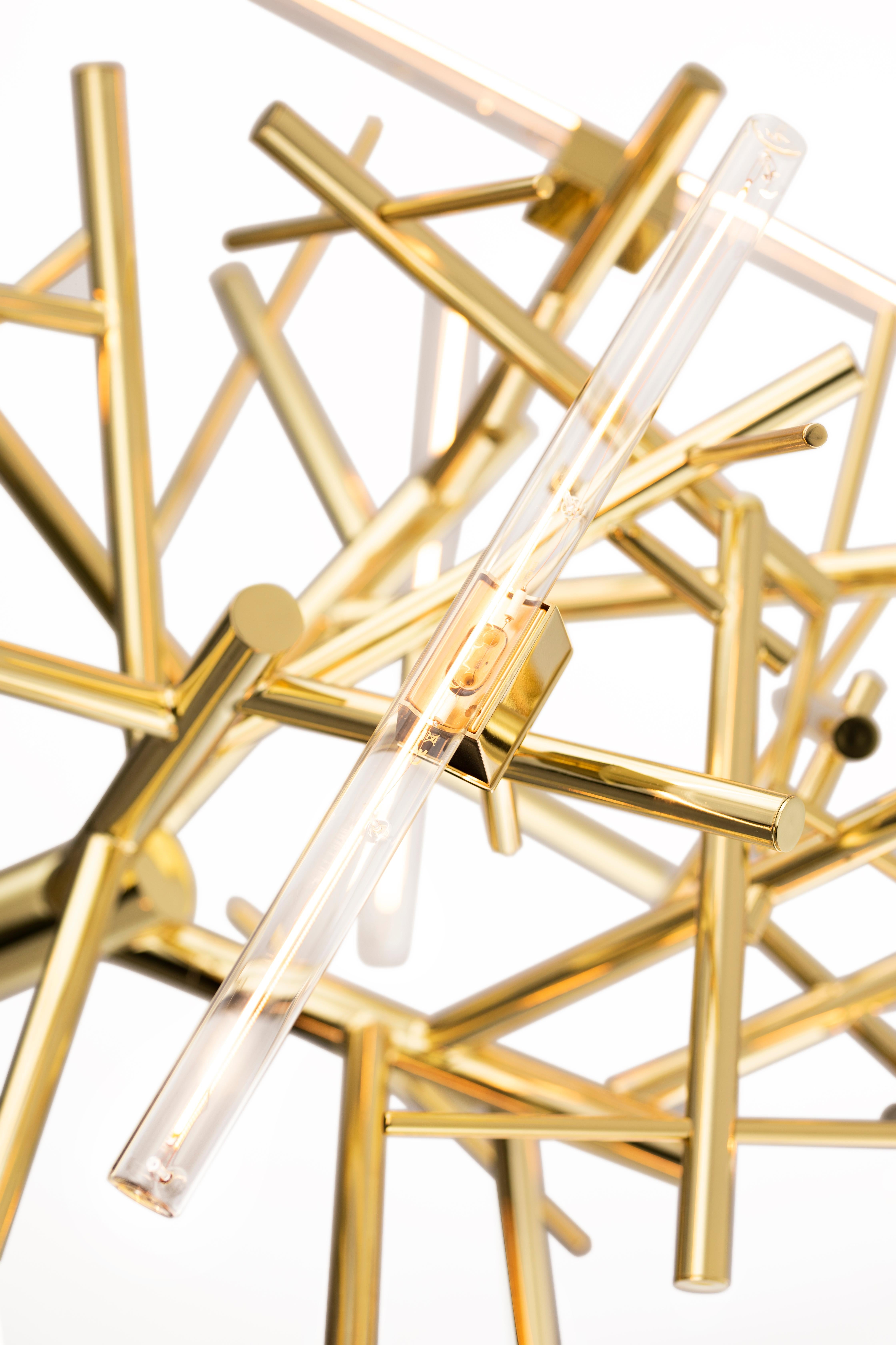 The Linea, a modern chandelier in a brass finish, is designed by William Brand, founder of Brand van Egmond. Creating a statement and adding light to each interior, the chandelier is available in four sizes in the finishes black matte, nickel,