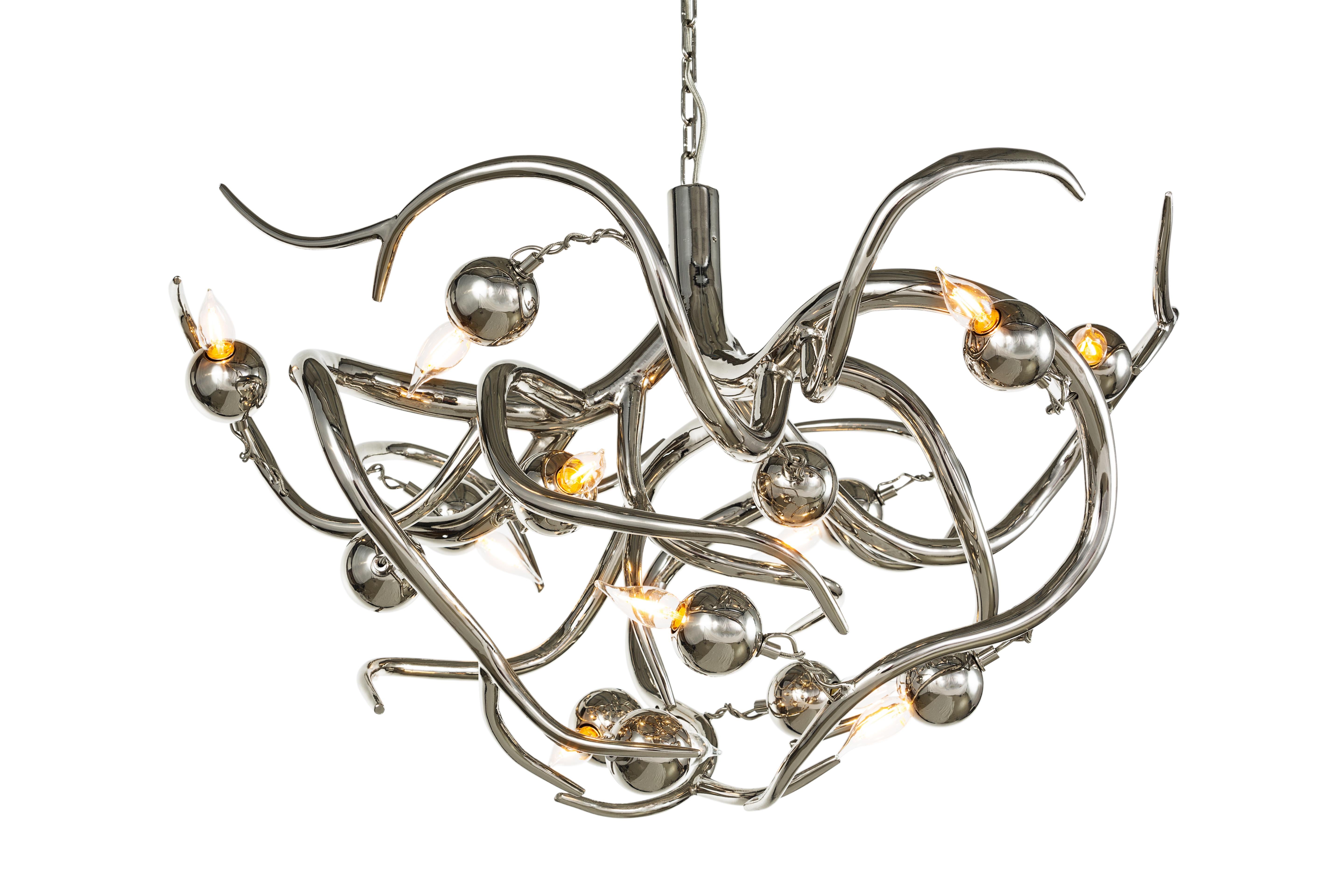 The Eve, a modern chandelier in a nickel finish, is designed by William Brand, founder of Brand van Egmond. Sculptural and full of character, the Eve chandelier is available in a round, oval or conical chandelier. There are several possible finishes