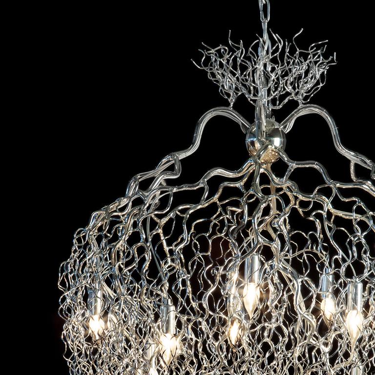 The Kelp, a modern chandelier in a nickel finish, is designed by William Brand, founder of Brand van Egmond. Crafted by hand in the atelier of Brand van Egmond, this chandelier is available in a chandelier conical and chandelier conical oval. With