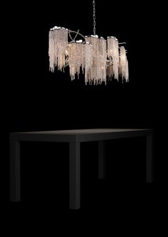 Modern Chandelier in an Oval Shape and in a Nickel Finish with Crystals