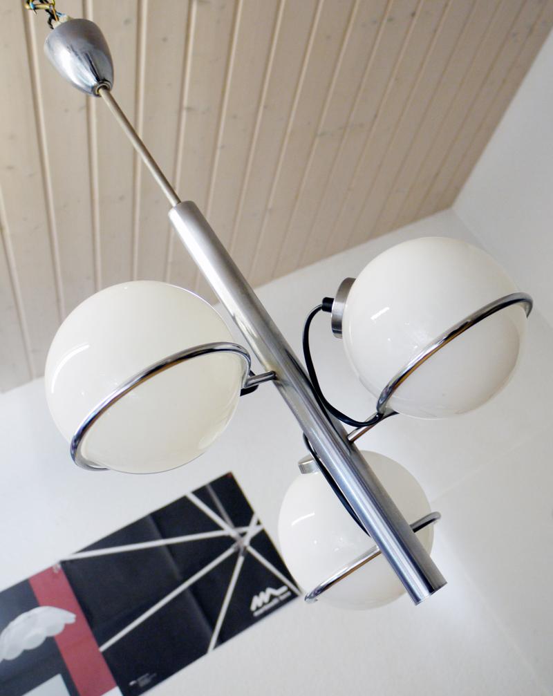 Design: Gino Sarfatti attr. 
Model: Sputnik Pendant. 
Style: Mid-Century Modern. 
Materials: opaline glass and chromed brass. 
Colors: white, silver and black. 
Manufacturer: Oluce attr. 
Country of origin: Italy. 
Year of production: 1963.