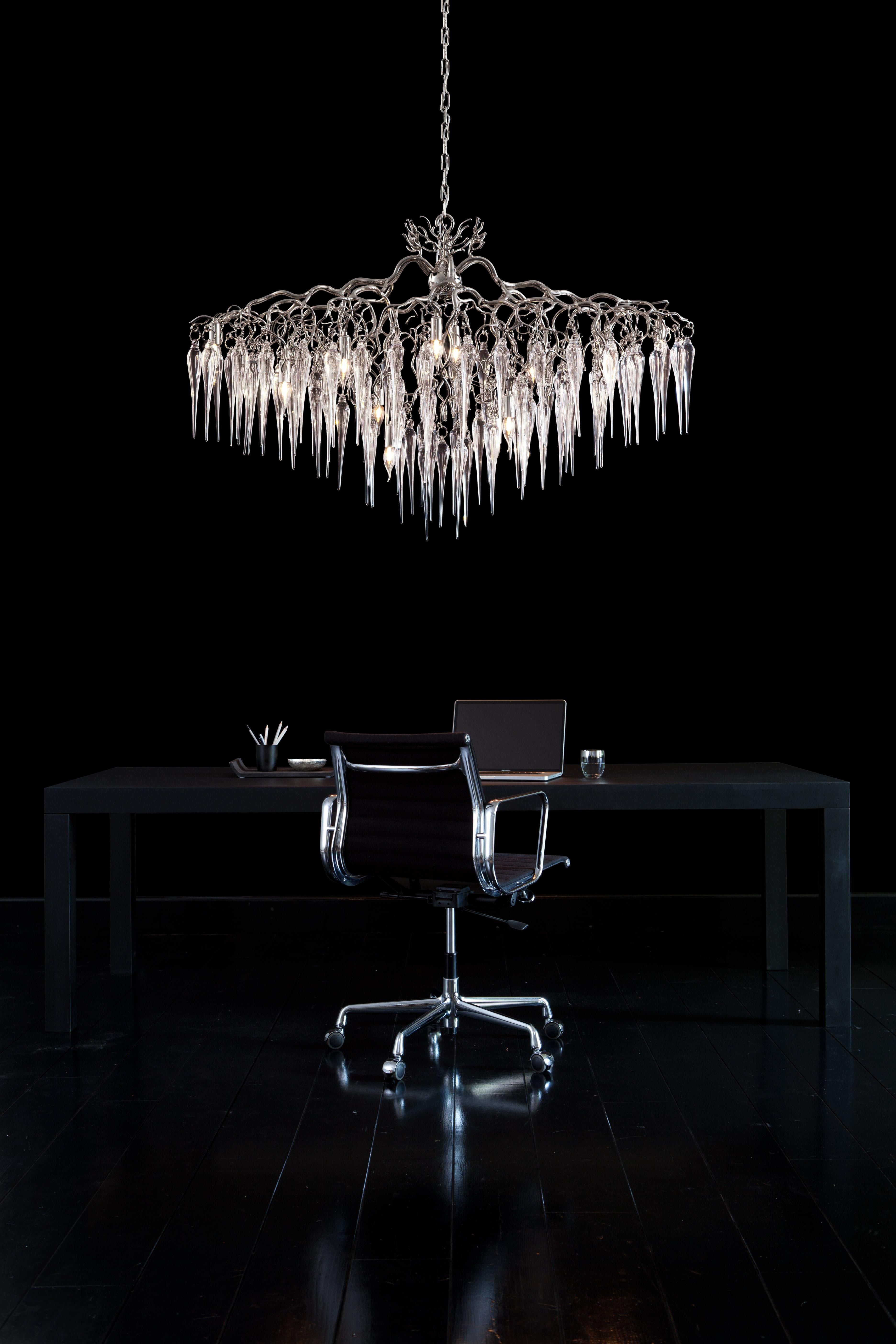 This modern chandelier in a nickel finish is dressed with mouthblown glass icicles, crafted in our own atelier. The Hollywood Icicles collection is designed by William Brand, founder of Brand van Egmond.

In the sheltered heart of a tree, when the