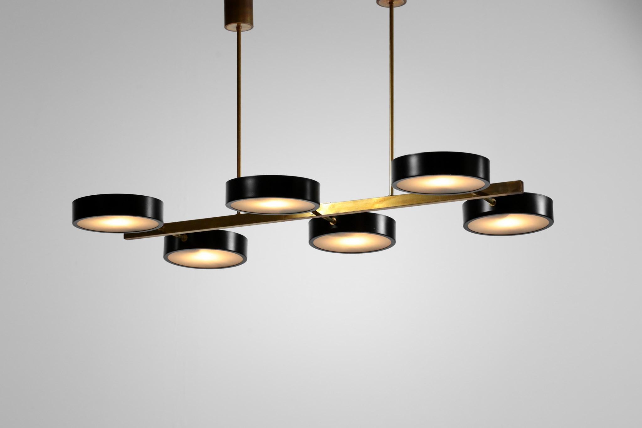 Handcrafted chandelier with 6 light in the style of Hans-Agne Jakobsson.
Structure in brass with black shade and glass on each light.
E14 bulb.