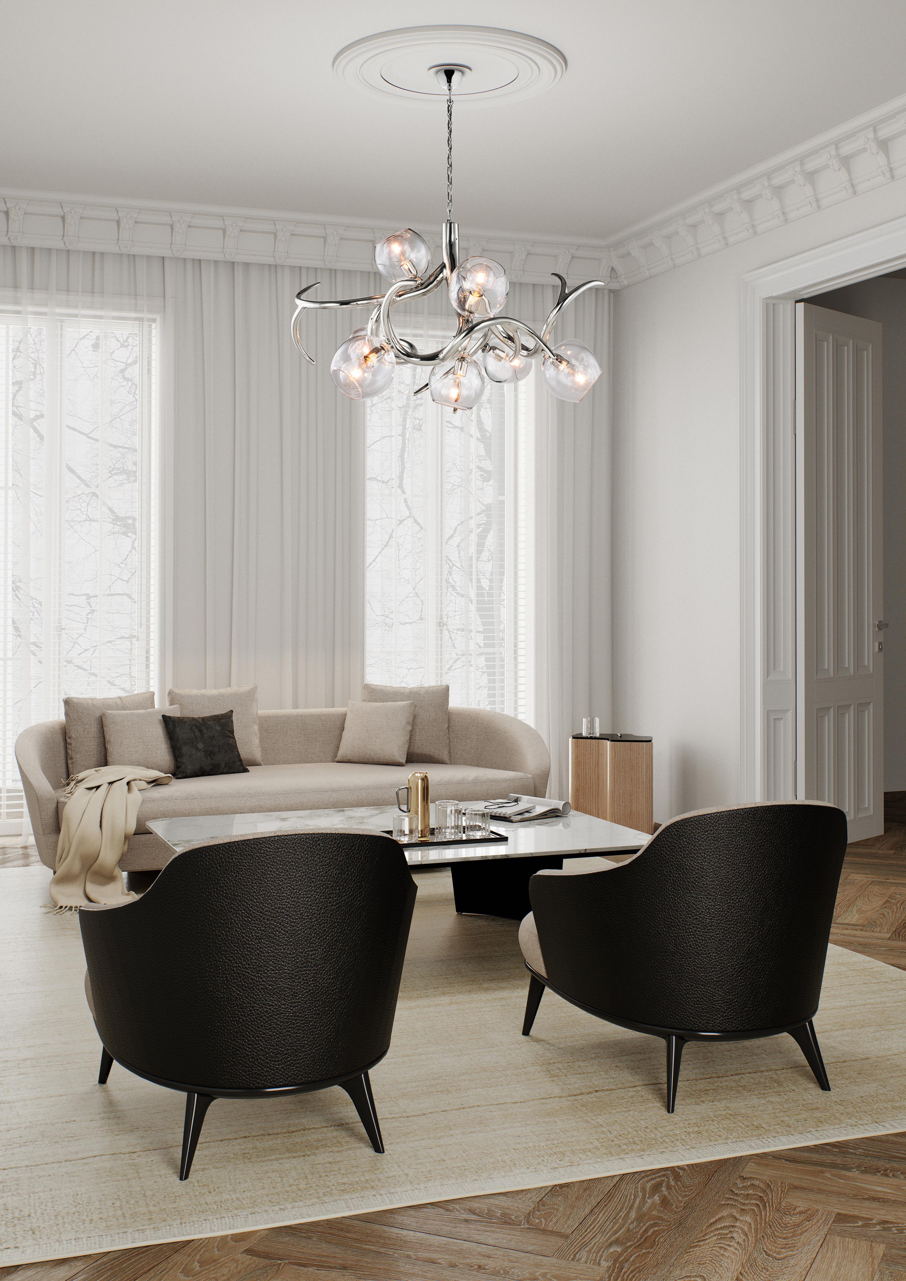 The Ersa, a modern chandelier in a black matte finish with glass spheres,, is designed by William Brand, founder of Brand van Egmond. Sculptural and full of character, the chandelier is available in three different models round, conical, and oval.