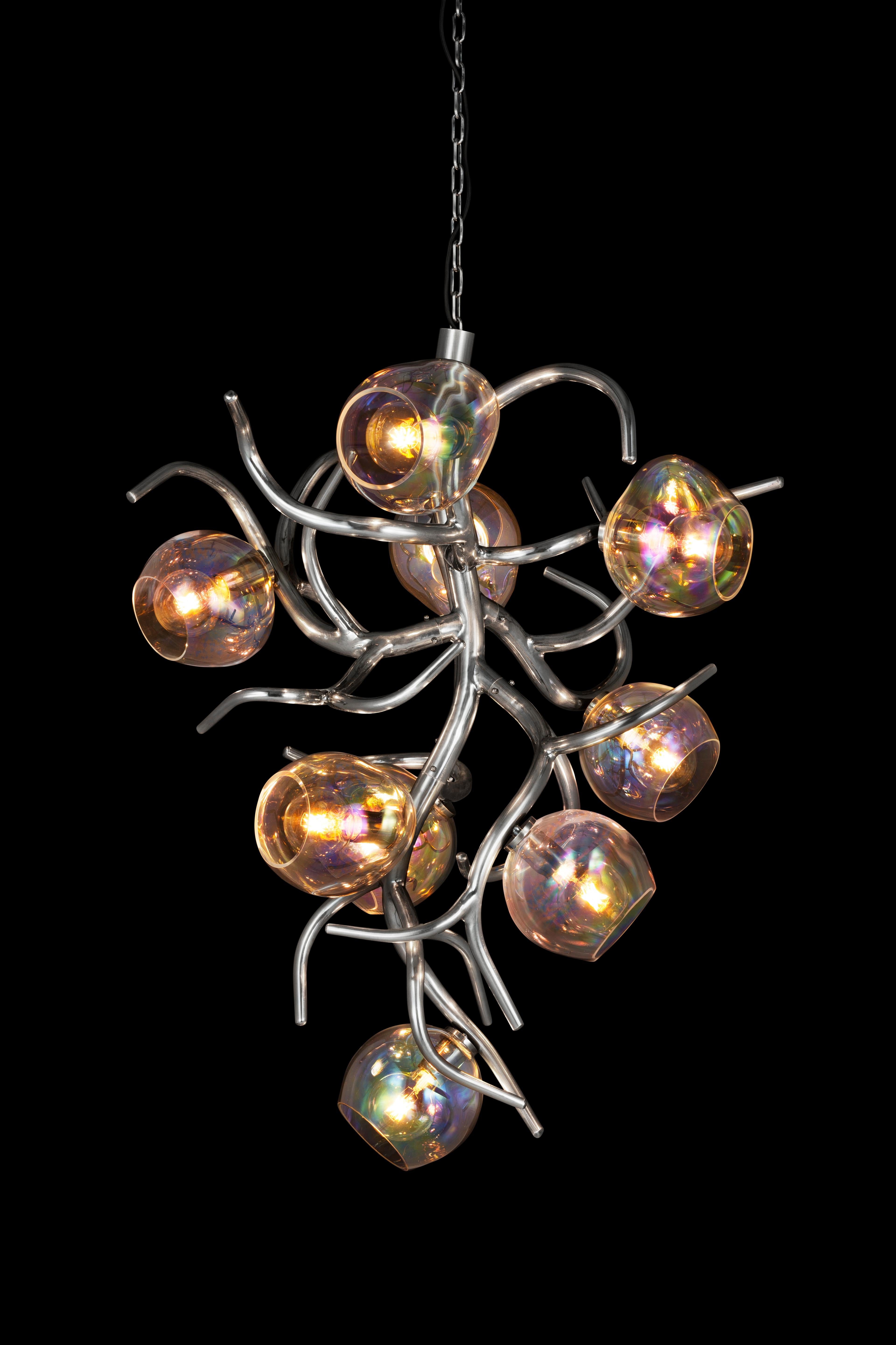 The Ersa is available in this modern chandelier conical with iridescent glass spheres, created to bring light and character into an interior. Crafted by our craftsman and glassblowers into a beautifully organic shape, bursting with life and energy,