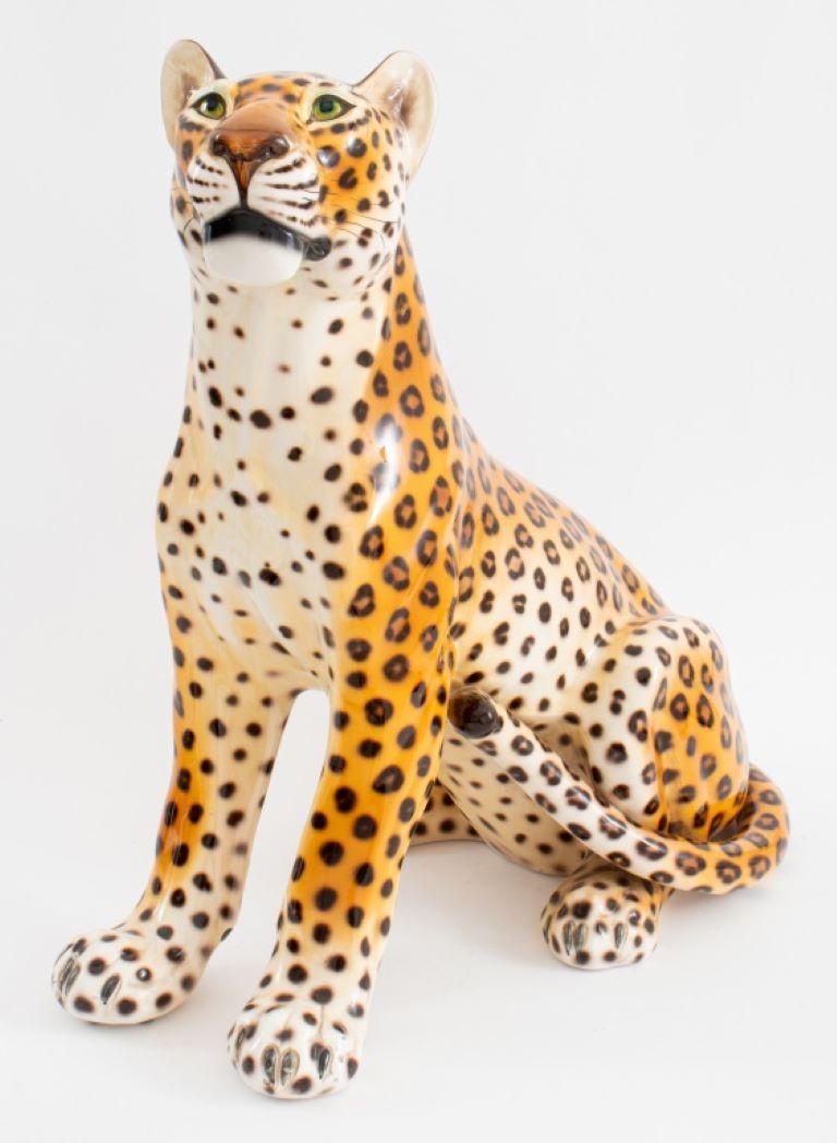 Modern large ceramic sculpture of a seated cheetah, apparently unsigned, older restorations to tail. 

Dealer: S138XX
