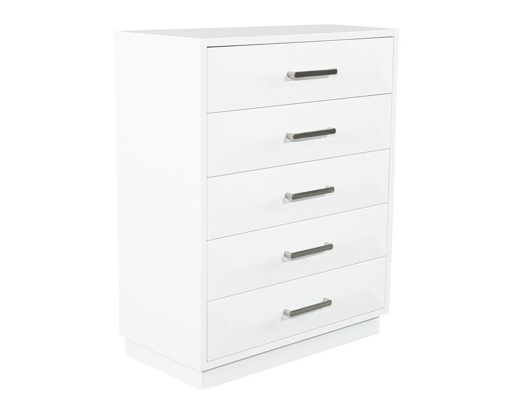 Elevate your bedroom with this stunning modern chest of drawers by Carrocel. Handcrafted in Canada, this chest boasts a striking geometric design on it’s drawer fronts, adding a touch of contemporary artistry to your bedroom. The beautiful walnut